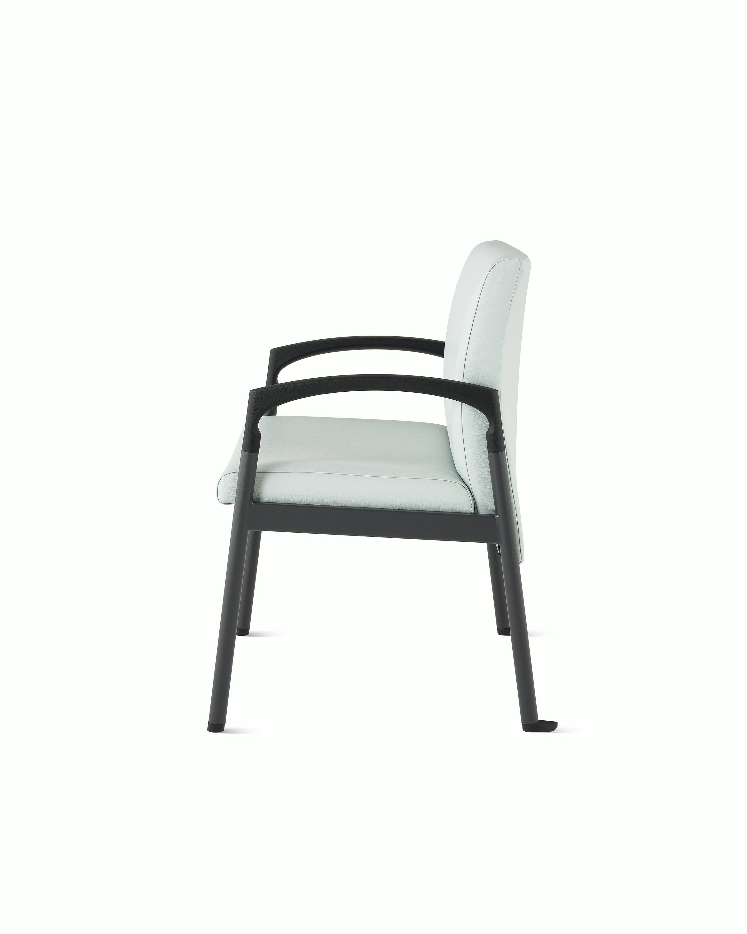 Side view of a Valor plus-size chair in a light gray upholstery and black frame on white sweep.