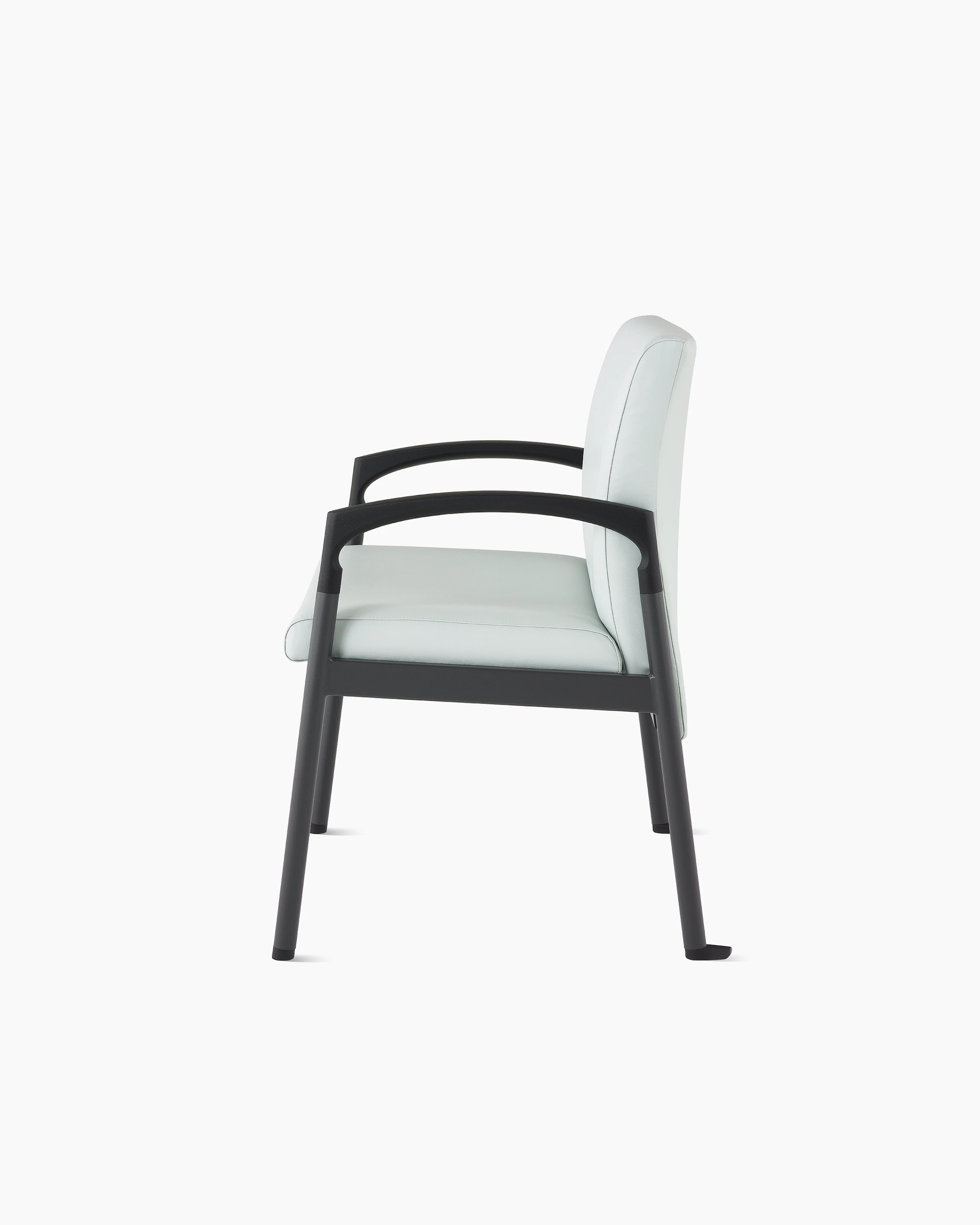 Side view of a Valor plus-size chair in a light gray upholstery and black frame on white sweep.