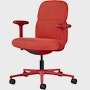 Front angle view of a mid-back Asari chair by Herman Miller in deep red  with height adjustable arms.