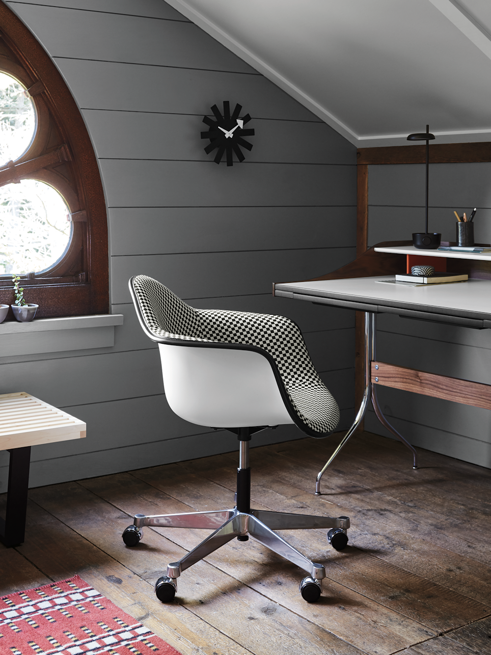 A residential work setting featuring an Eames Task Chair and Distil Desk.