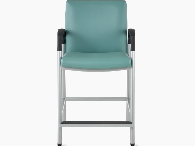 Front view of a Valor Easy Access chair in a blue-green upholstery with a silver frame and black armcaps on white sweep.