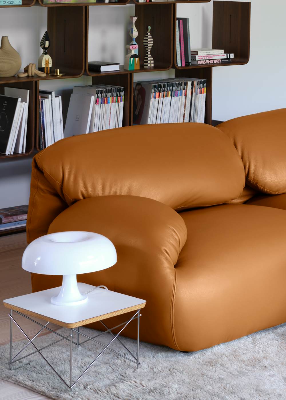 Nesso Table Lamp, Eames Wire Base Side Table, and Luva Modular 3 Seat Sofa in a living room setting