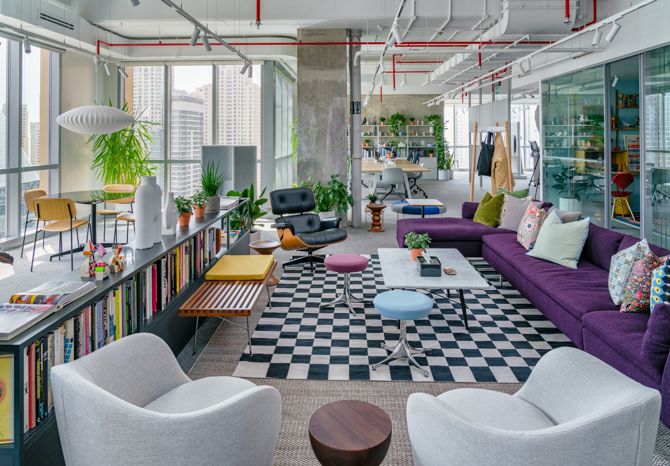 The reception area of the Herman Miller Dubai showroom with an Eames Lounge Chair, Lina Chairs, Bolster Sofa, HAY New Order Storage and a collection of side and coffee tables.
