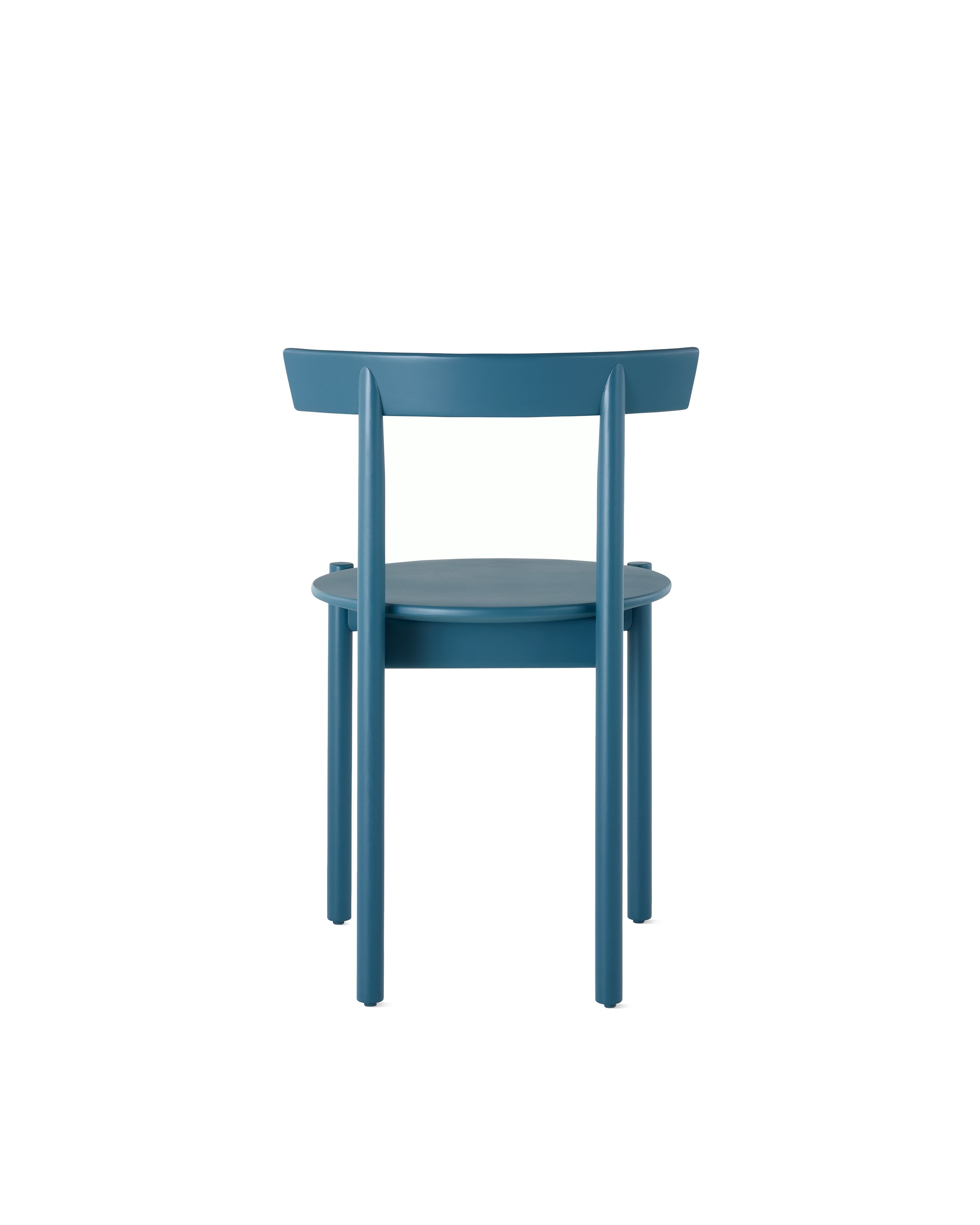 A blue Comma Chair, viewed from the back.