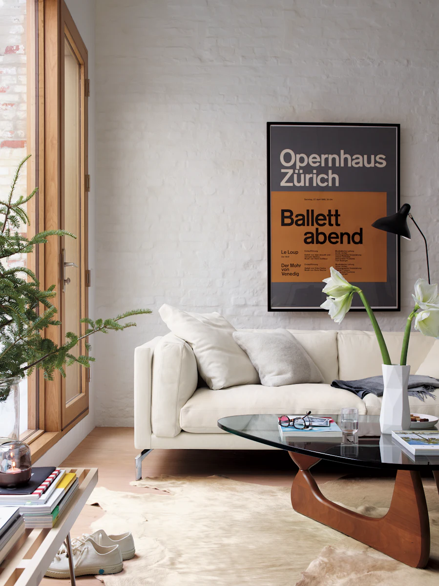 White sofa in a bright living room with artwork