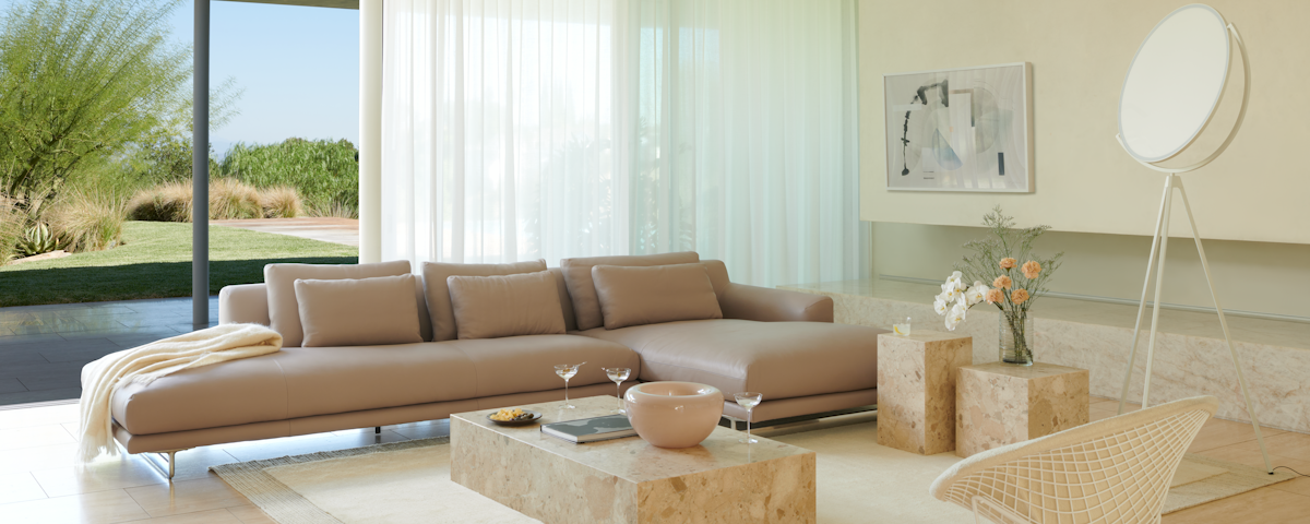 Lecco Open Sectional Sofa and Plinth Marble Coffee and Side Tables in a living room setting