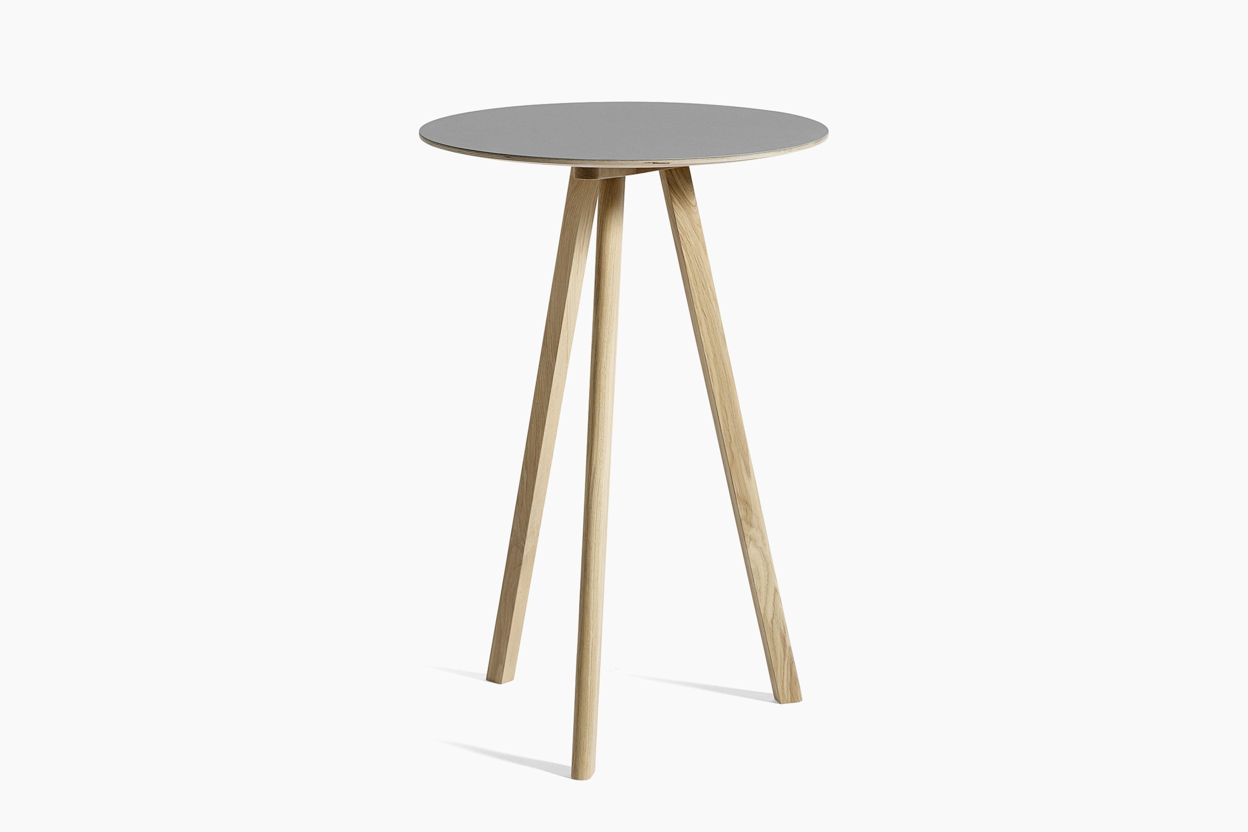 Grey Copenhague Bistro Table with wooden legs, viewed at an angle.