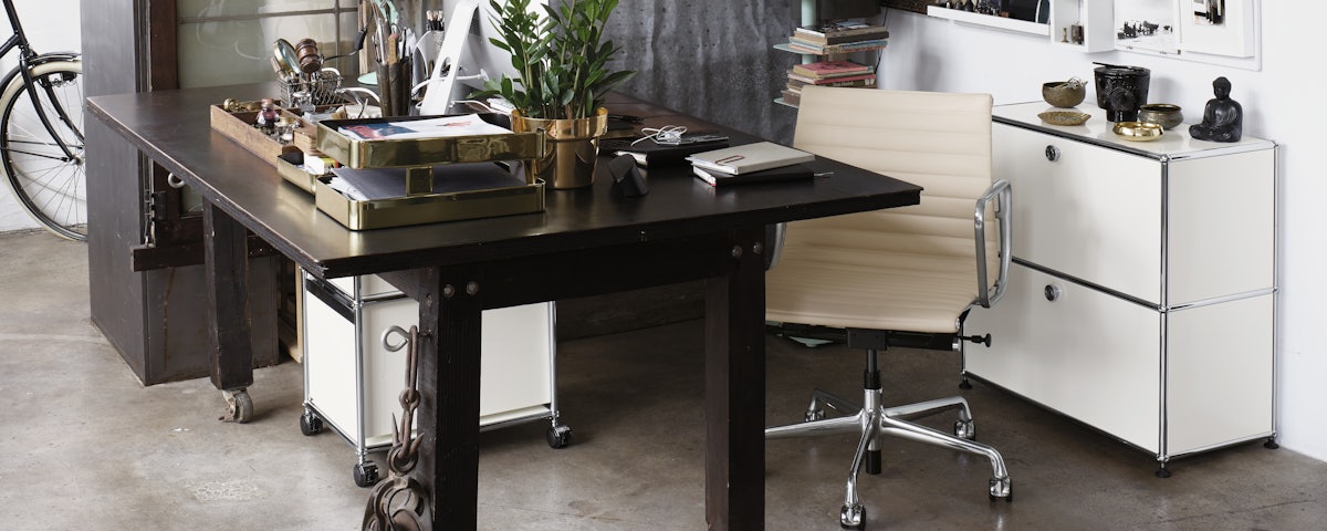 USM Haller File Credenza and Eames Aluminum Group Chair in office setting