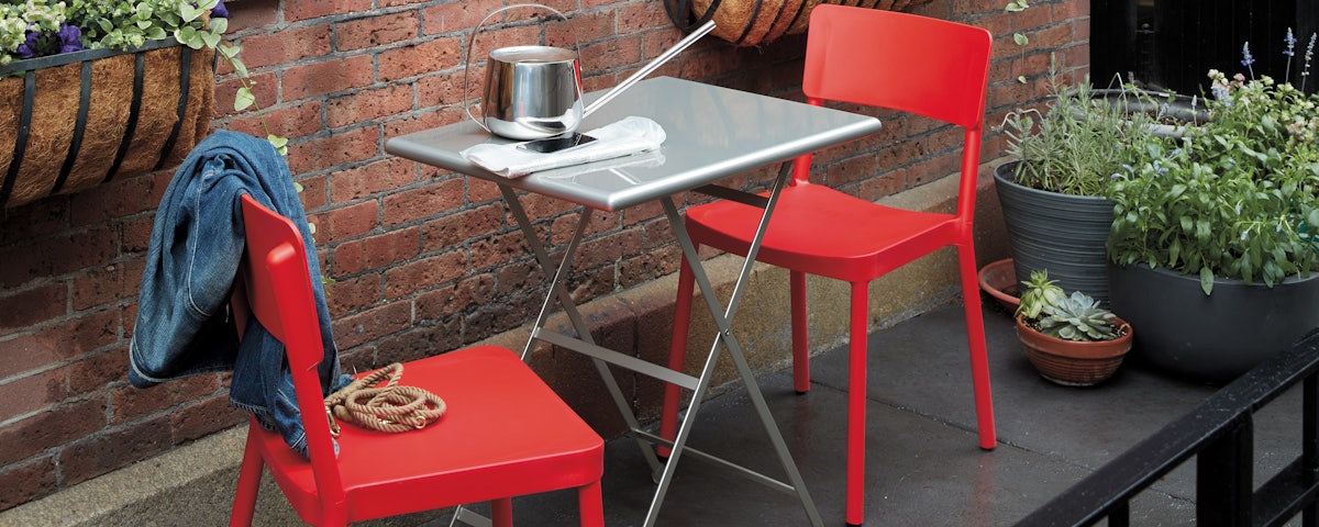 Sustainable Lisboa Chairs and cafe table in an outdoor patio setting