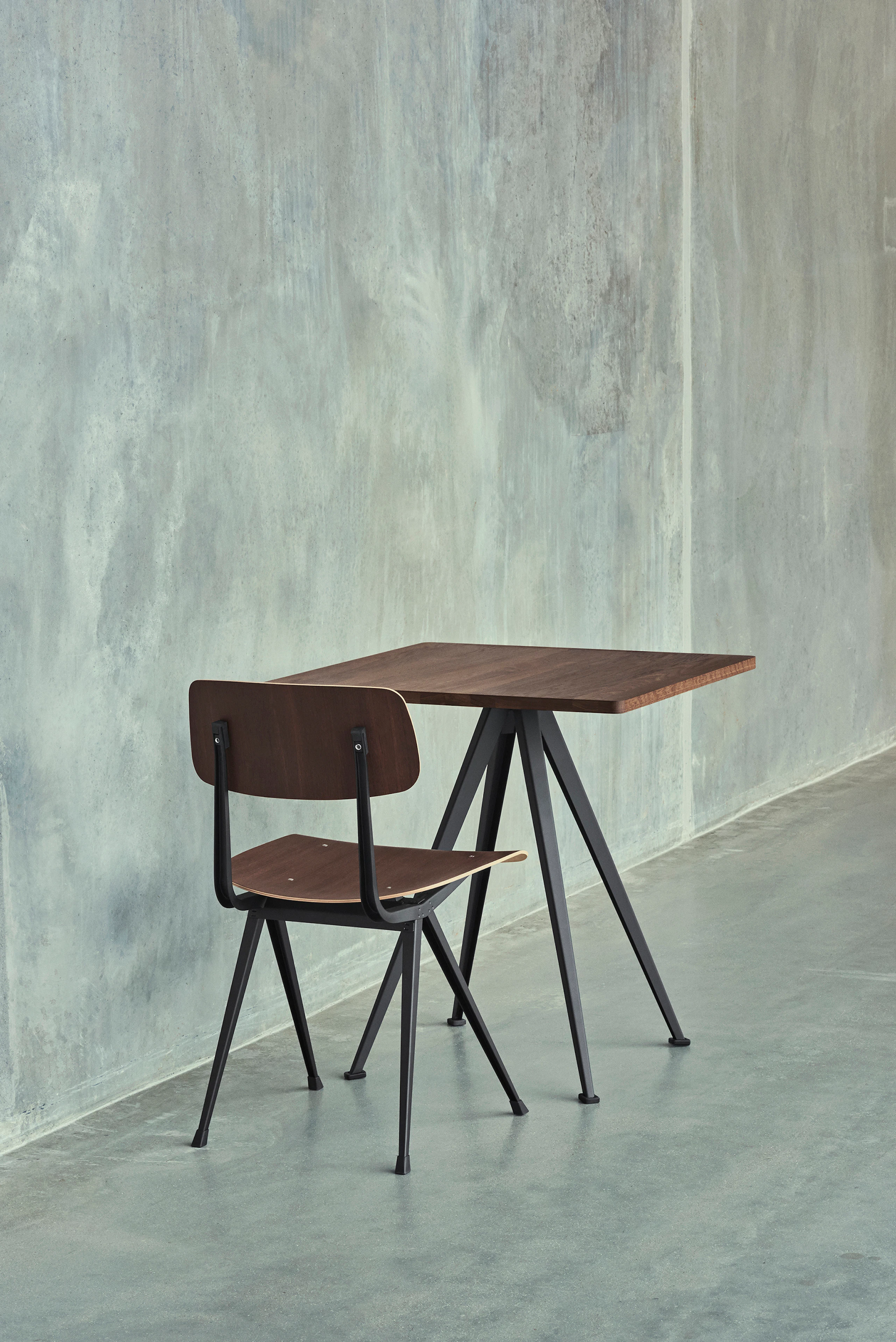 Pyramid Cafe Table with Smoked Oak top and black frame next to a Result Chair.