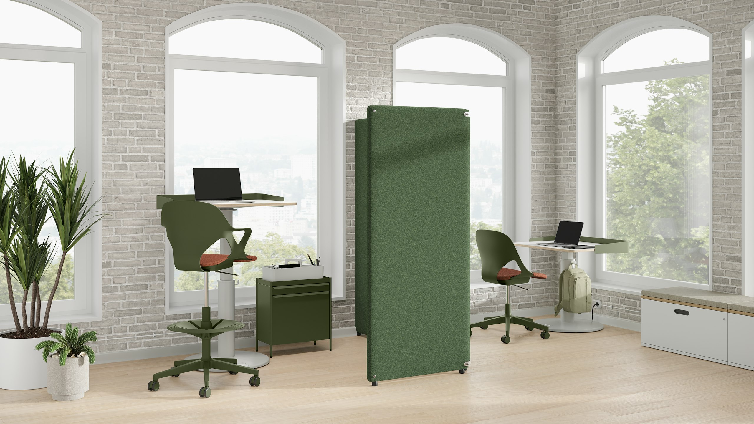 Bright office with a green Bound Freestanding Screen, green OE1 Storage Trolleys, green Zeph Chair and OE1 Sit-Stand Tables.