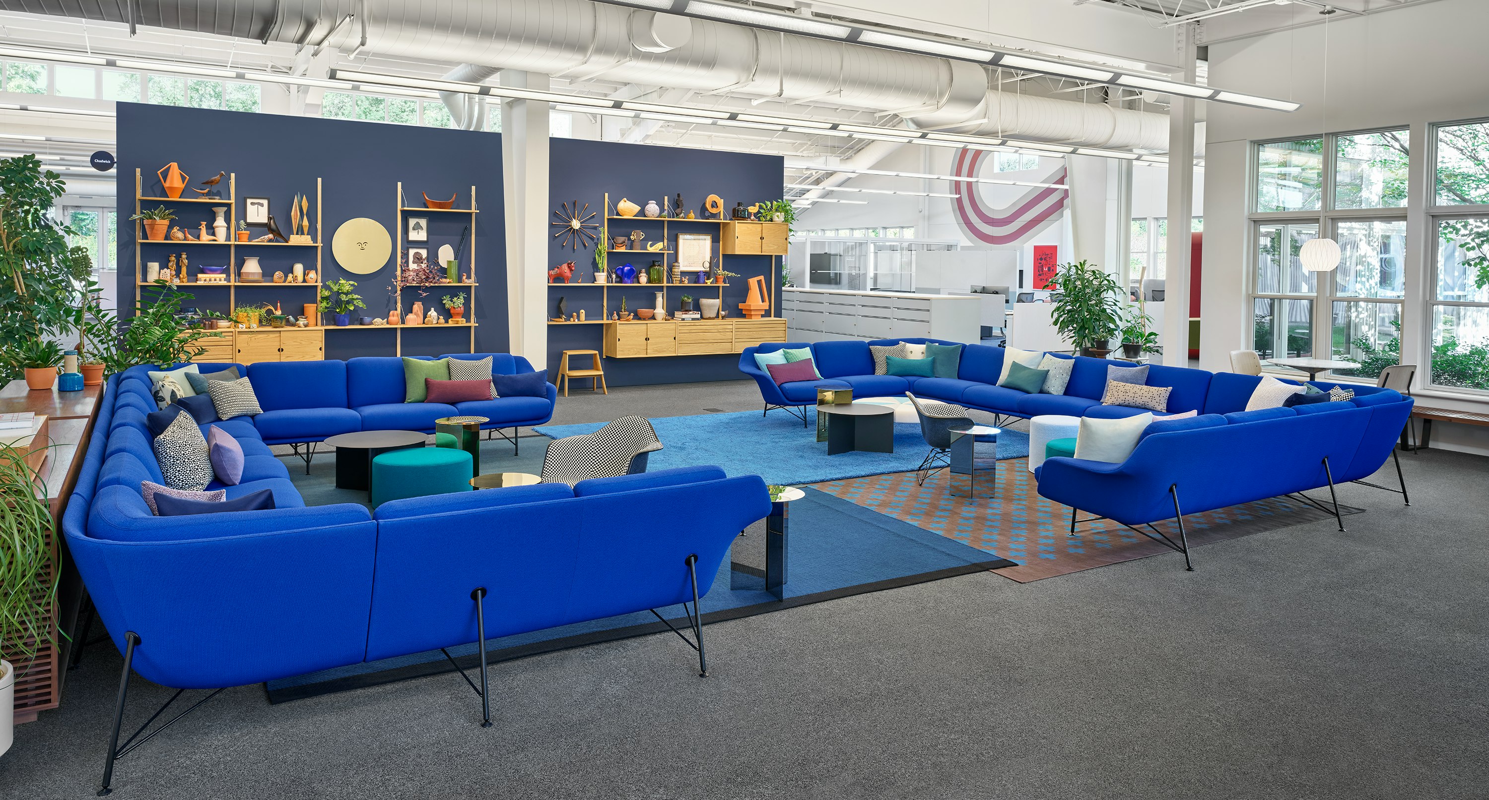 A collaborative space set up with Blue Striad Sofas.