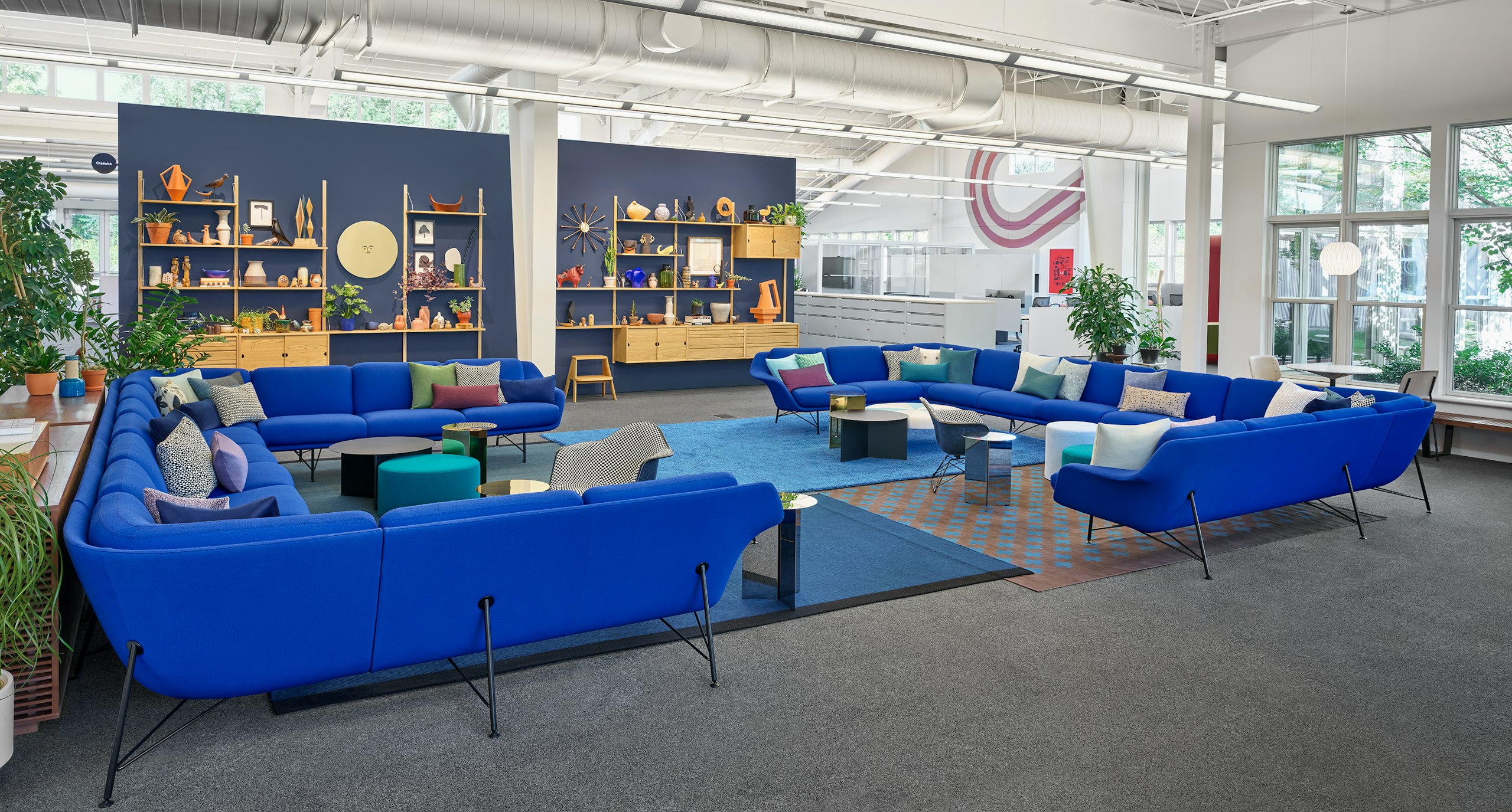A collaborative space set up with Blue Striad Sofas.