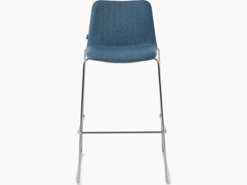 White sweep of Viv stool with blue fabric and polished aluminium sled base