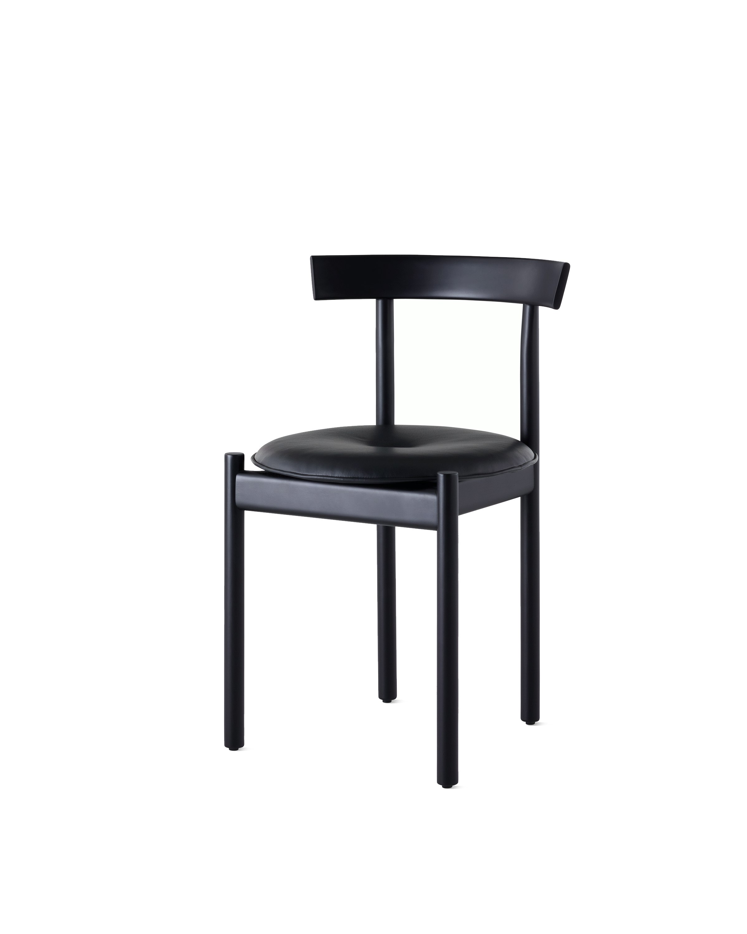 A black Comma Chair with a seat pad, viewed from the front at an angle.