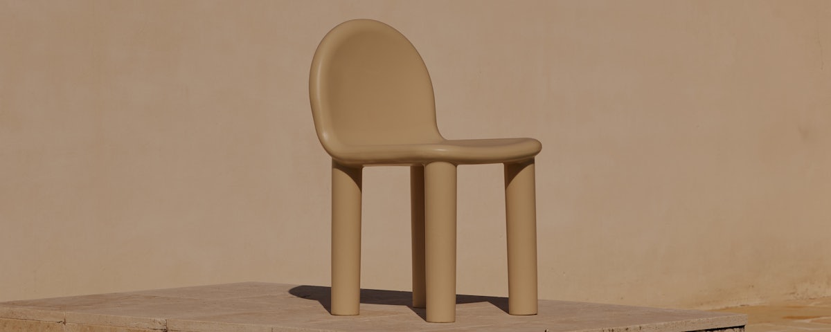 Arch Outdoor Dining Chair at a poolside setting