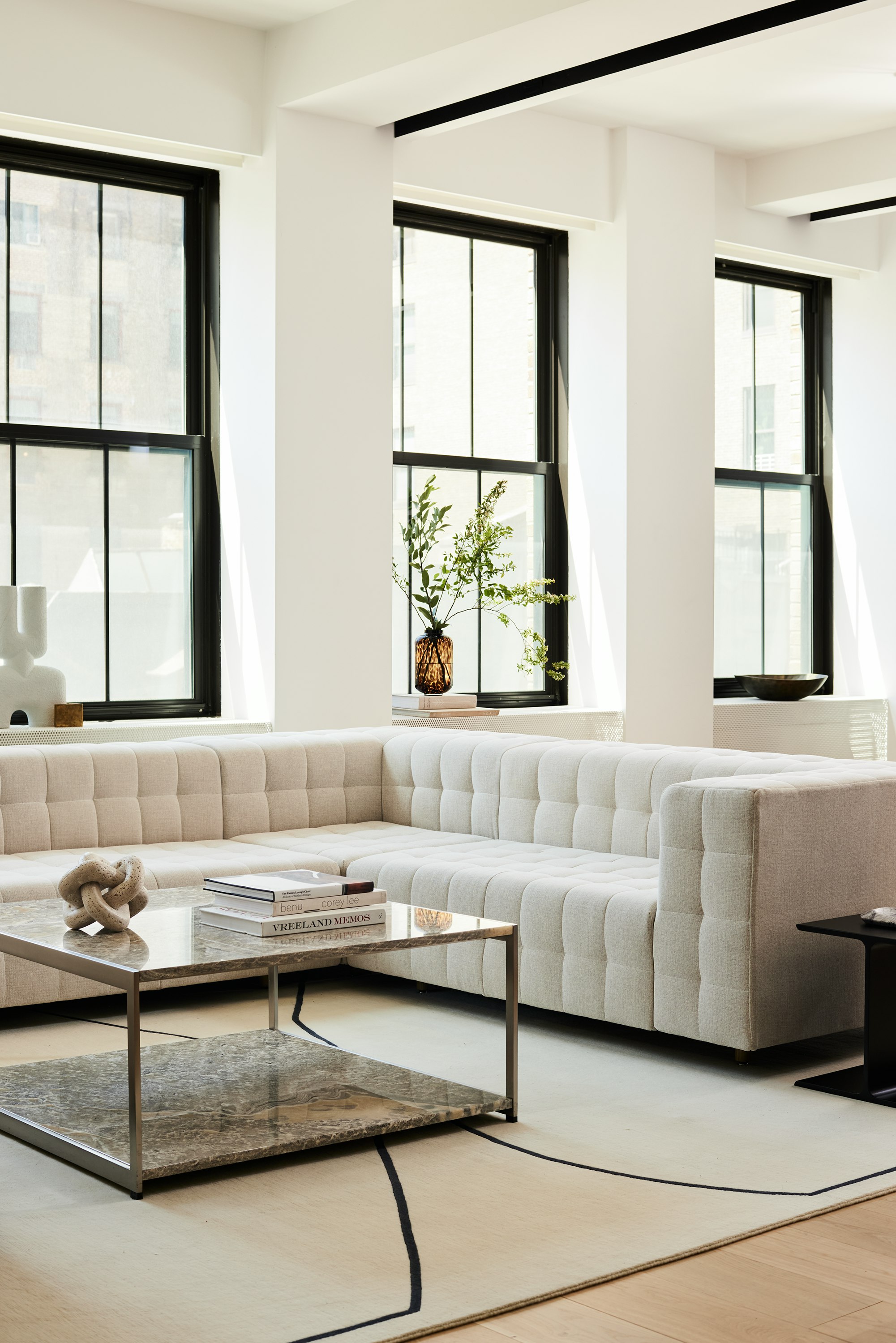 A contract lounge seating area with Rapport Sofa and H Frame Coffee Table.