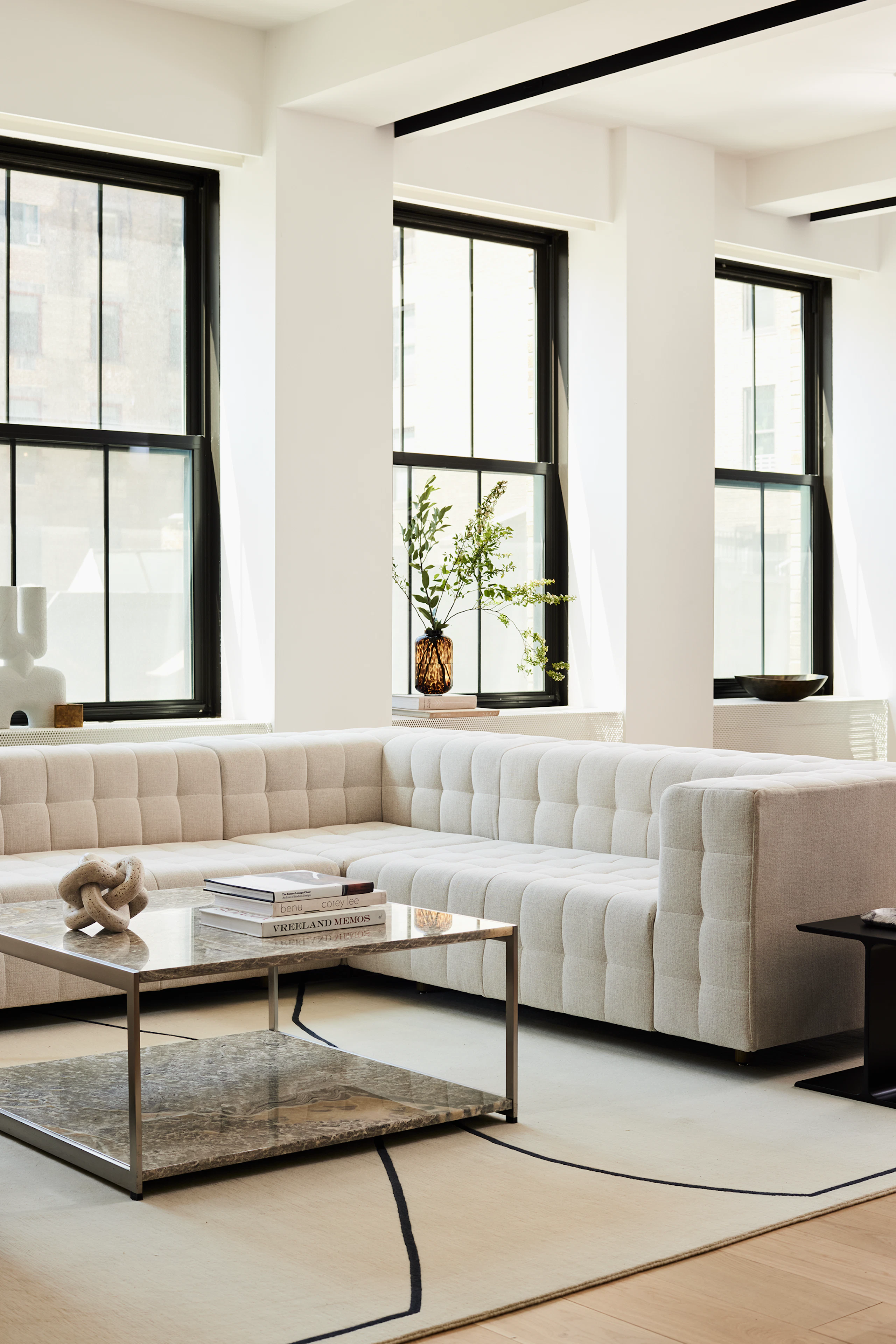 A contract lounge seating area with Rapport Sofa and H Frame Coffee Table.