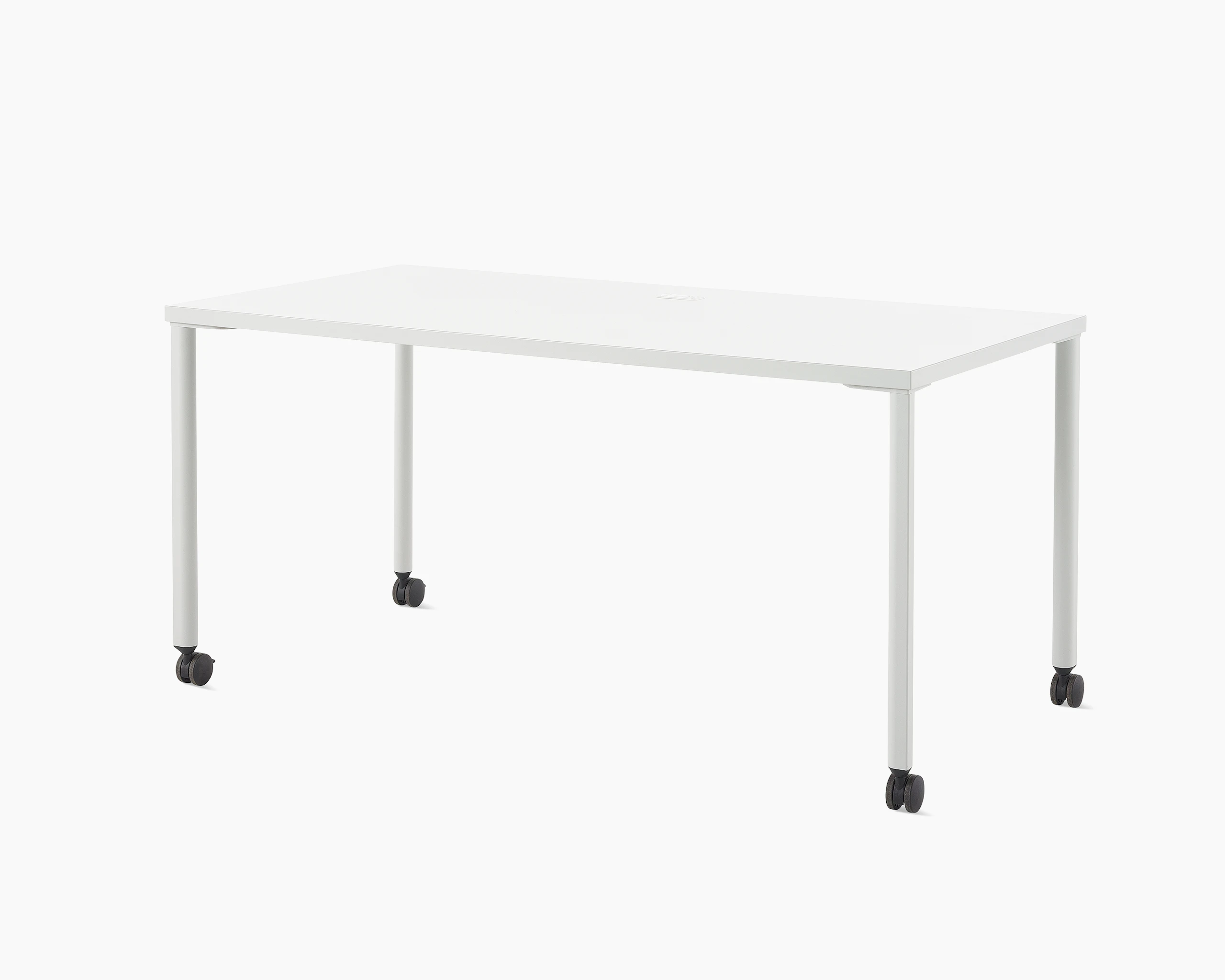 A white OE1 Rectangular Table with light grey legs and black casters, viewed from an angle.