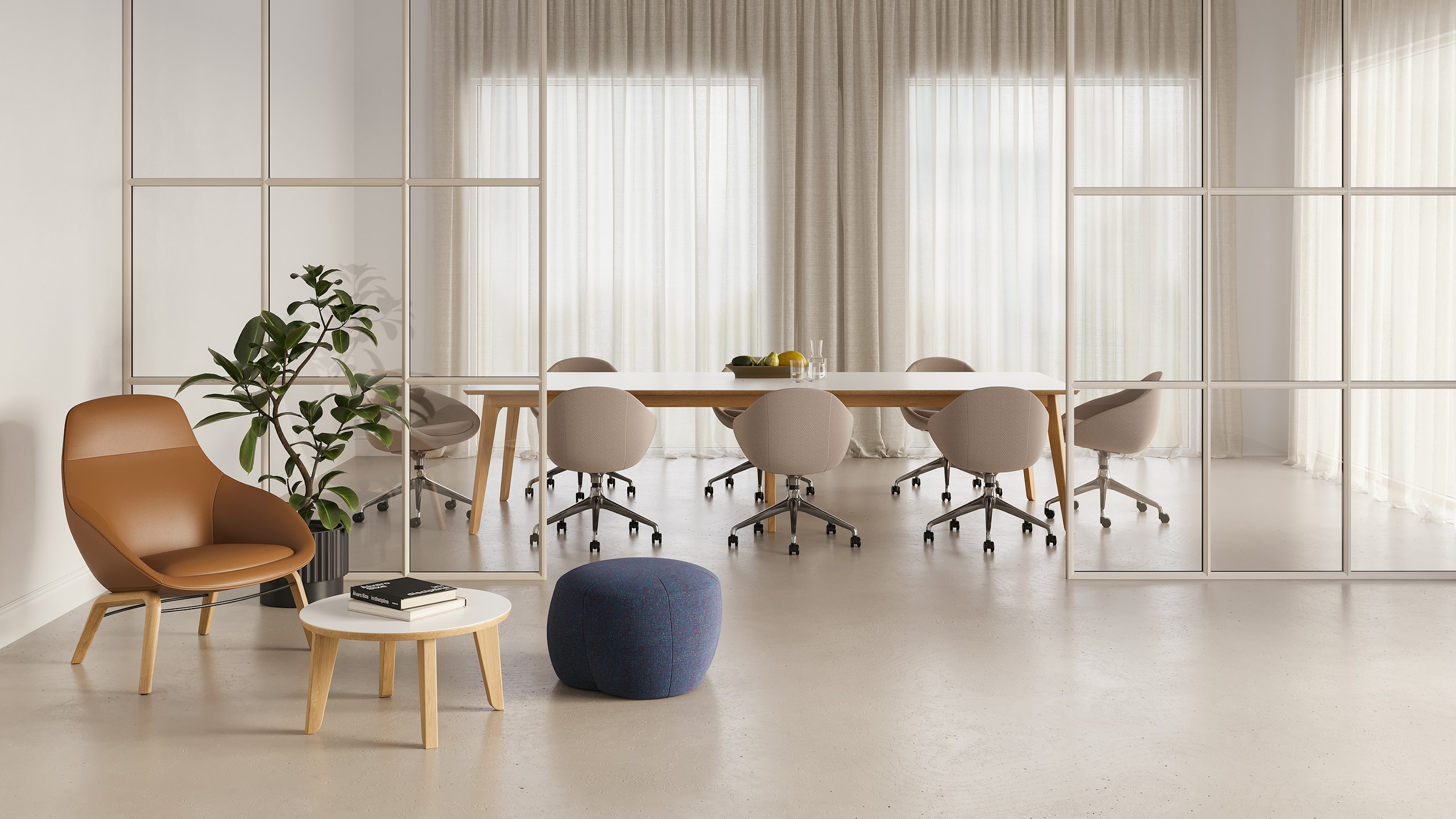 A lounge setting outside a meeting room showing a low Truffle Pouf and Always Lounge Chair on either side of a Dalby Coffee Table.