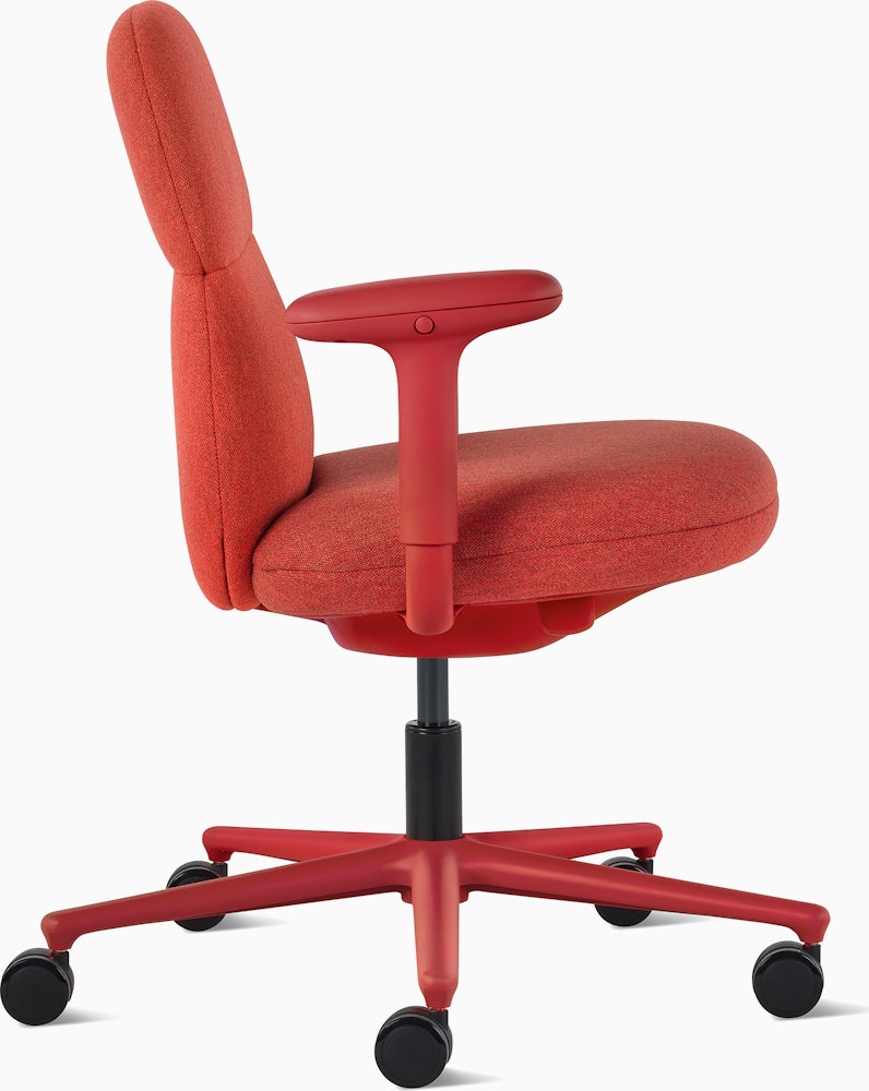 Front angle view of a mid-back Asari chair by Herman Miller in deep red with height adjustable arms.