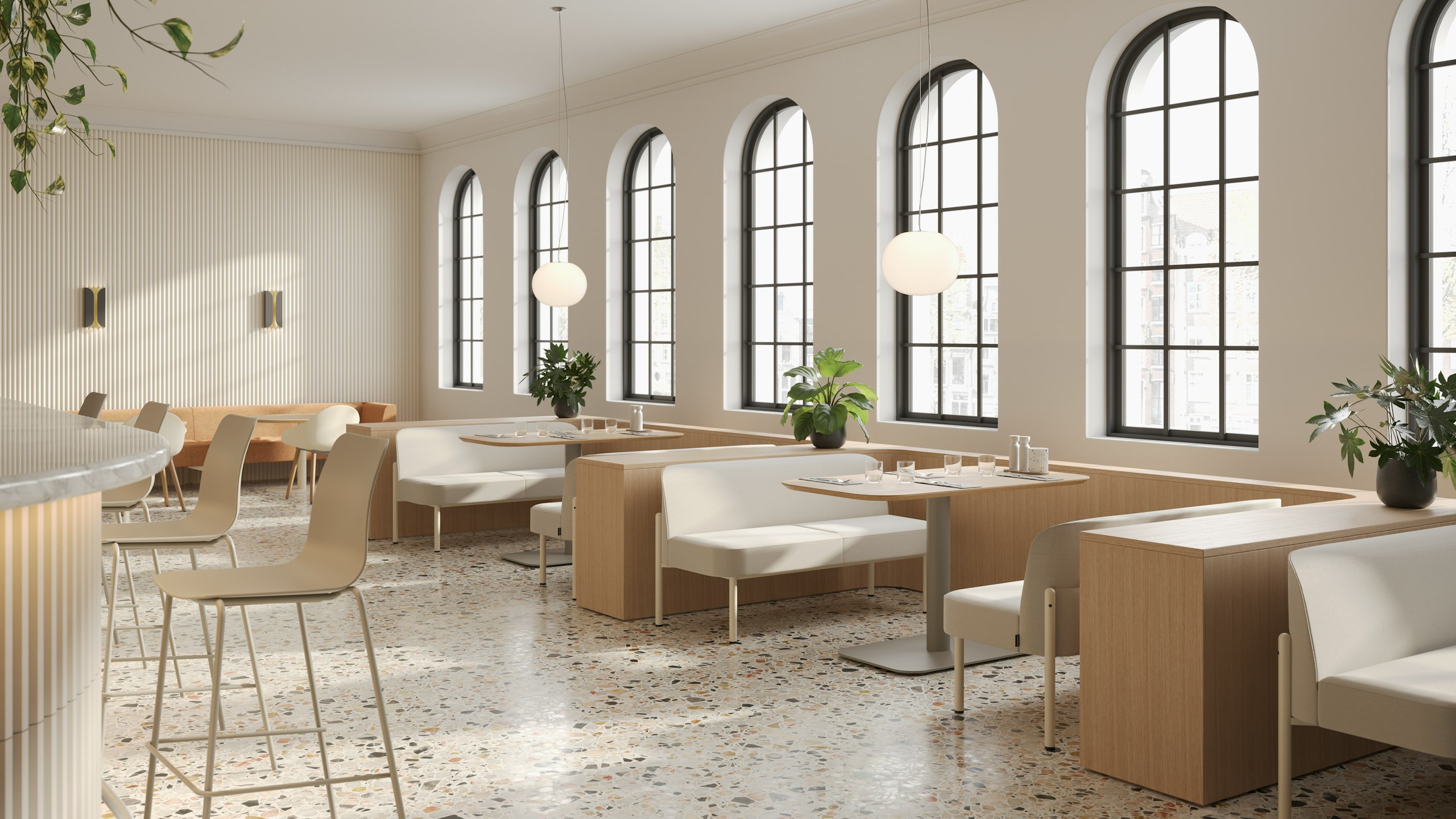 Hue Sofas with Oyster legs, upholstered in Geiger Kalista Natural paired with Hue Tables with Stone Grey bases, arranged to look like booths in a cosy dining setting.