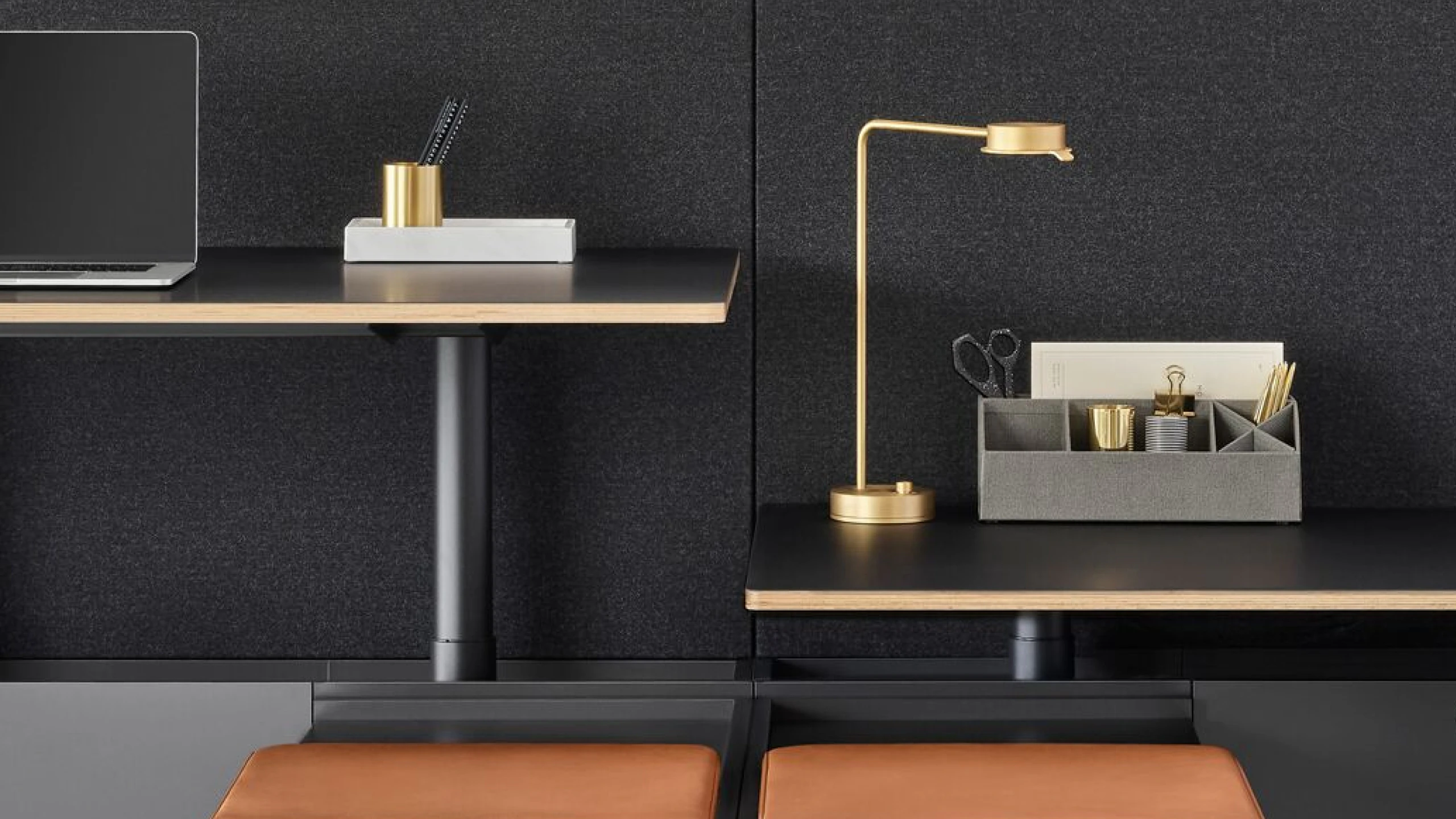 A two-pack Geiger One Casegoods bench system. One workstation is at standing height while the other is at sitting height.