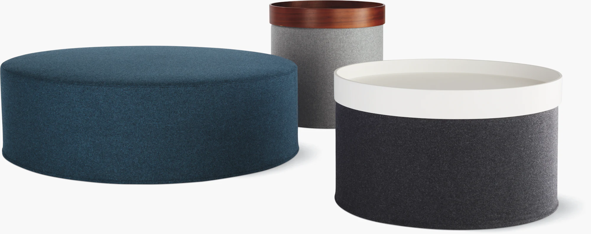 Collection of drum poufs in multiple colors on a white background