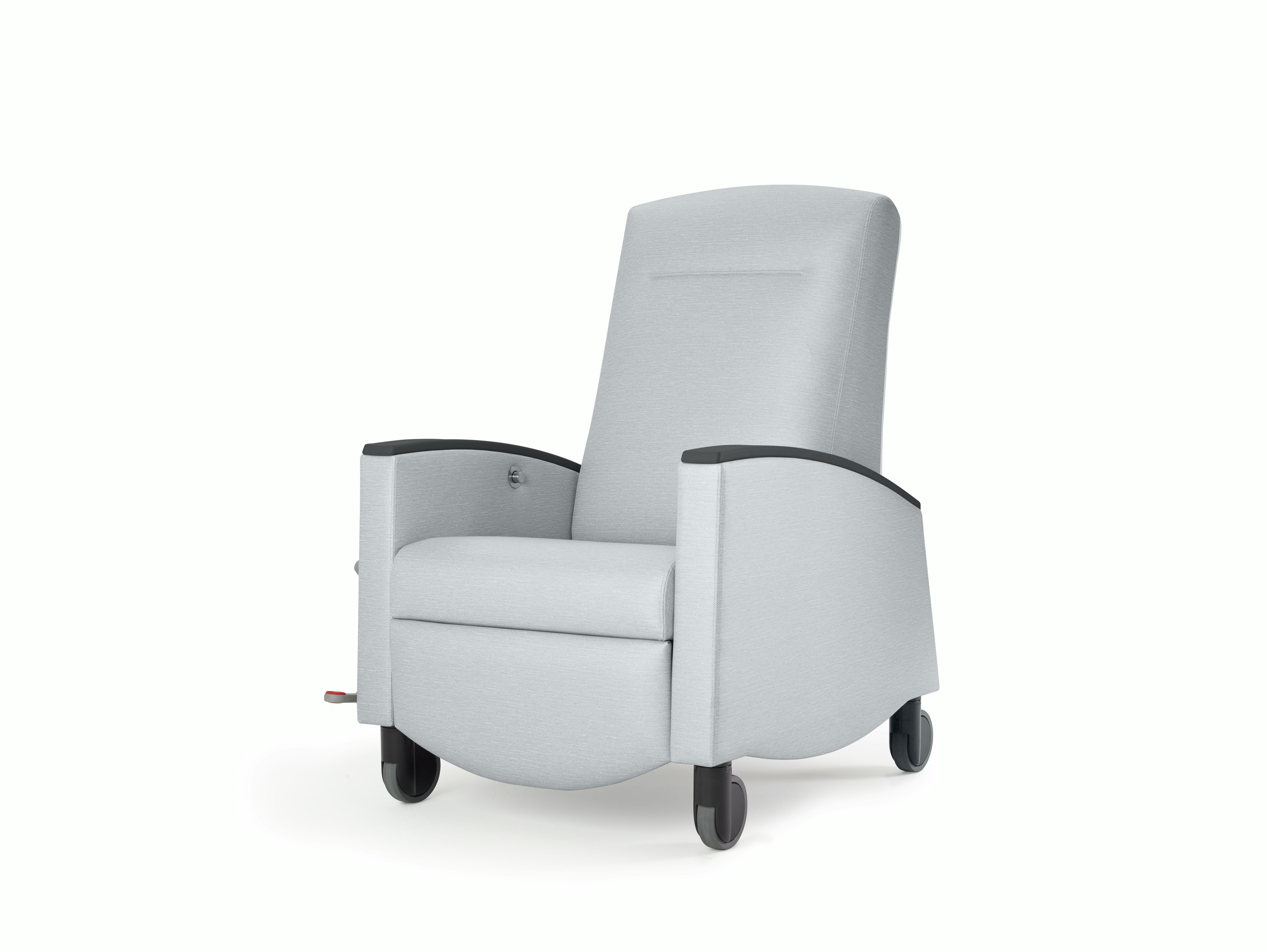 Nemschoff Sahara Recliner in a light gray upholstery with black arm caps and casters on white sweep, viewed at an angle.