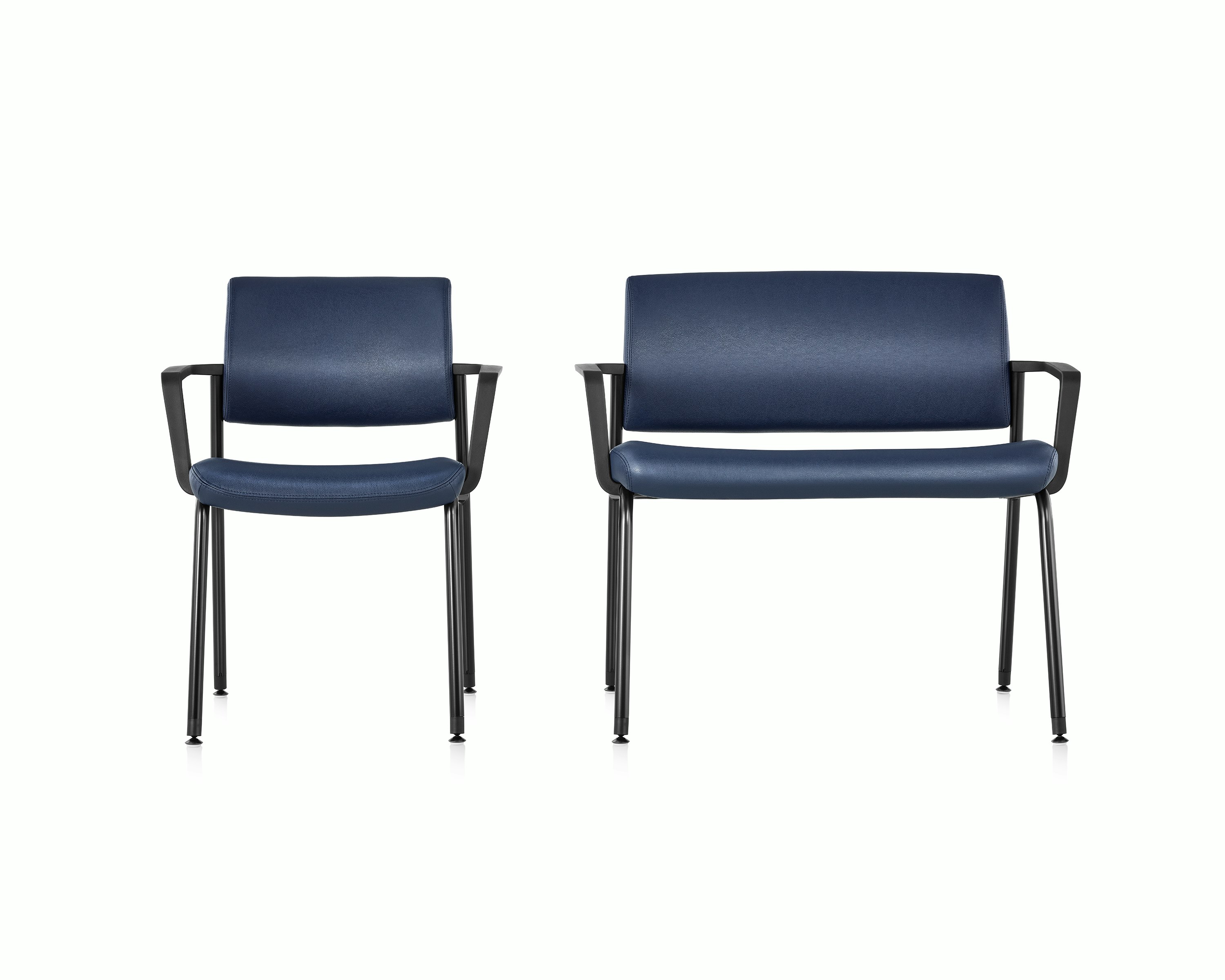 Front view of Verus Side Chair and Verus Plus Chair. Both with arms and upholstered in blue vinyl.