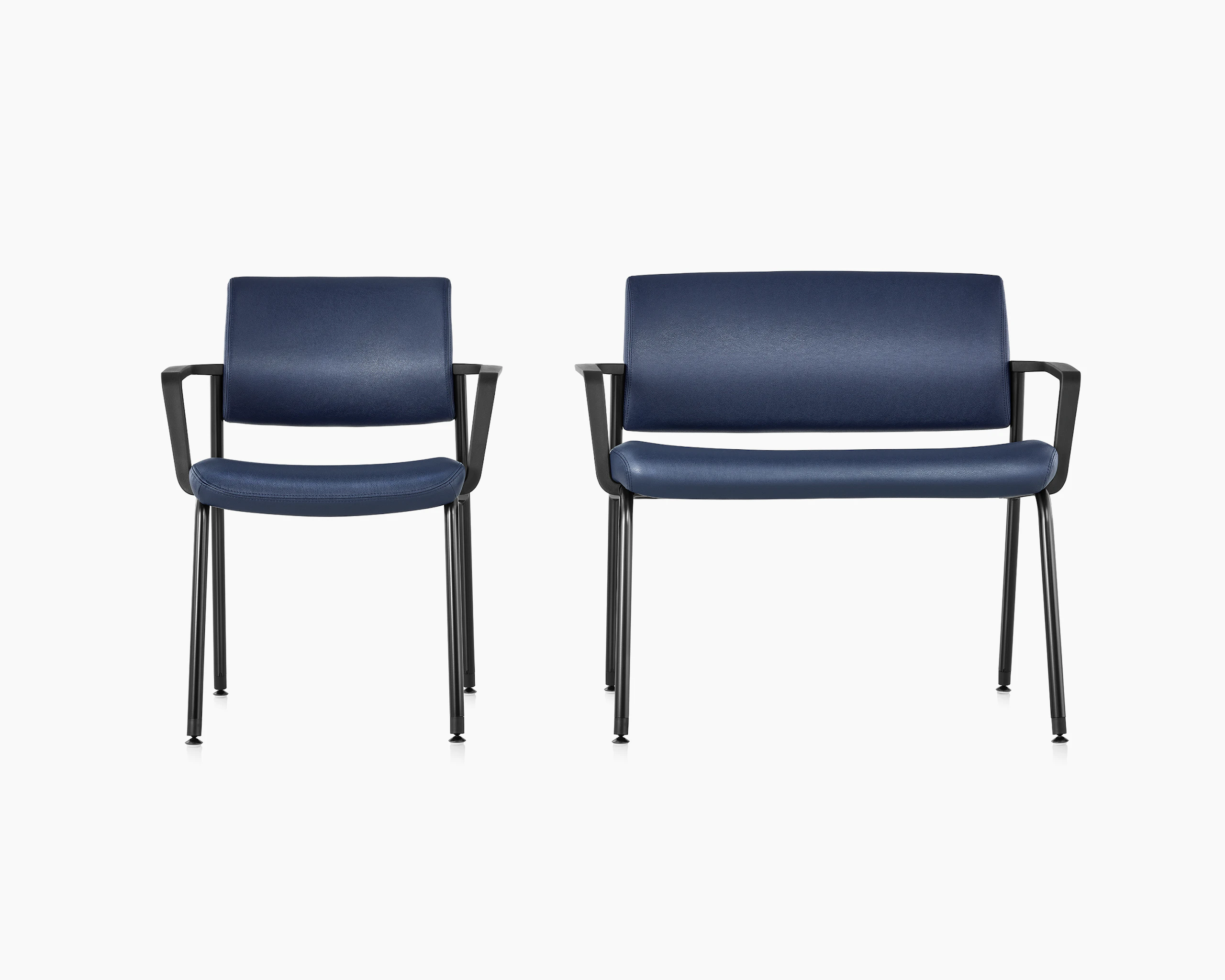 Front view of Verus Side Chair and Verus Plus Chair. Both with arms and upholstered in blue vinyl.