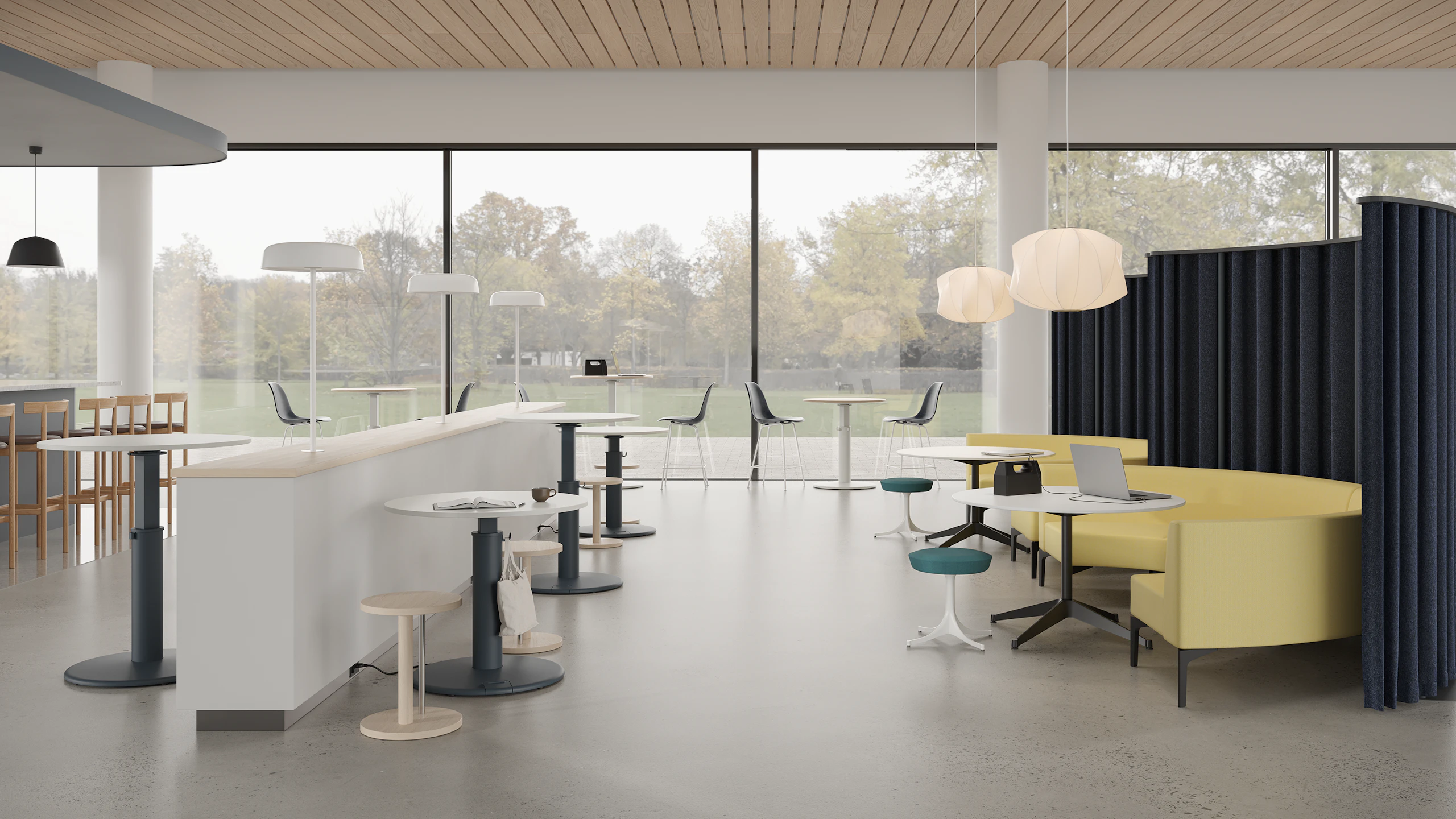 Community socialization area with OE1 Sit-to-Stand Tables, OE1 Freestanding Curtains, occasional tables and sofas.