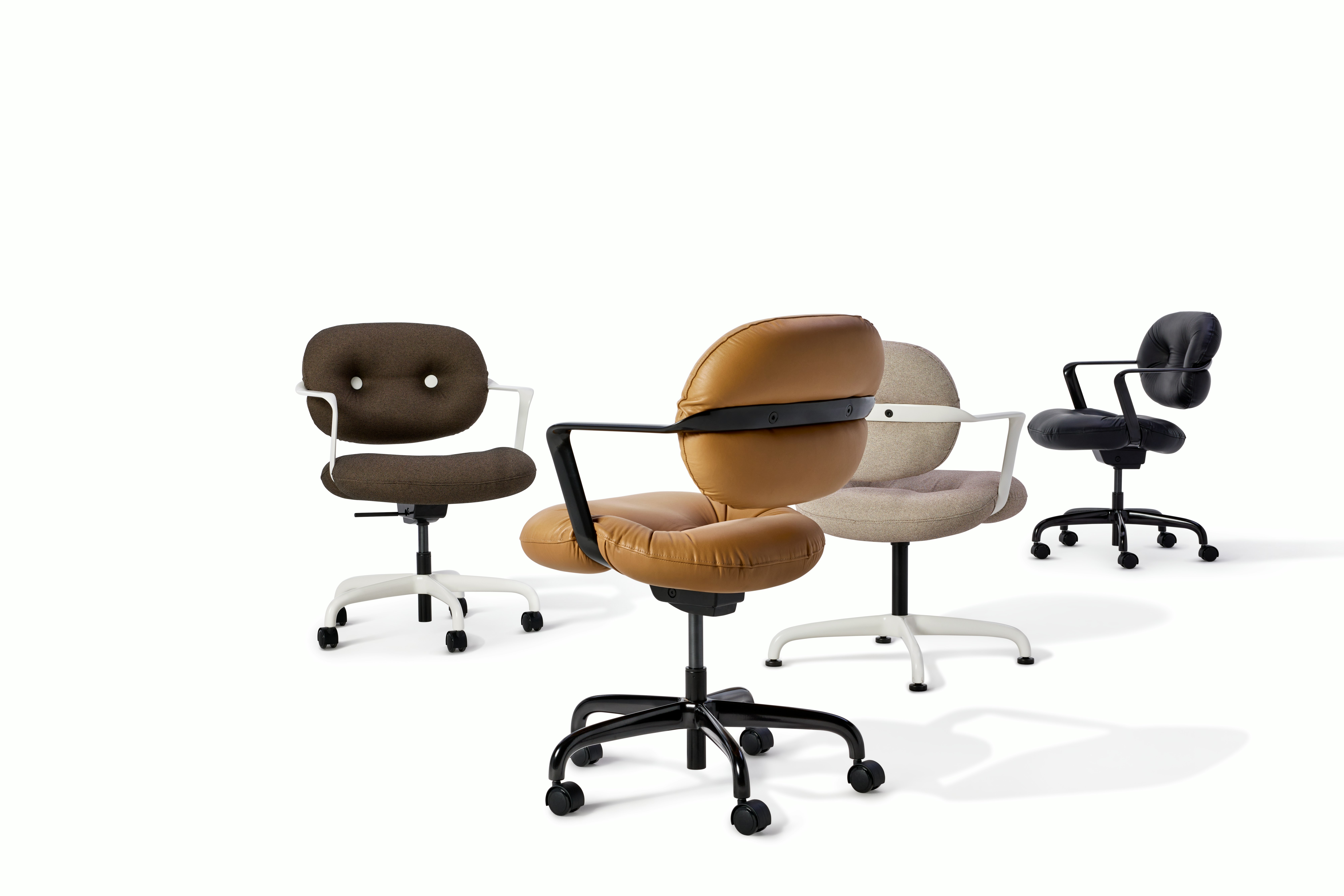 A group of four Morrison Hannah Chairs with fixed arms. The group includes three work chairs in brown and black and one side chair.
