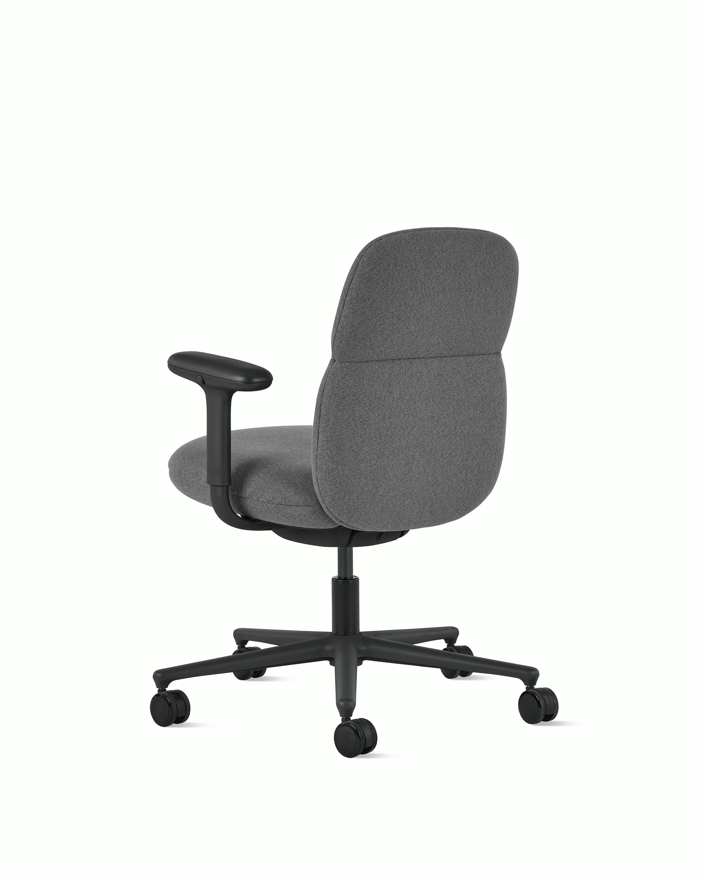 Rear angle view of a mid-back Asari chair by Herman Miller in dark grey with height adjustable arms.