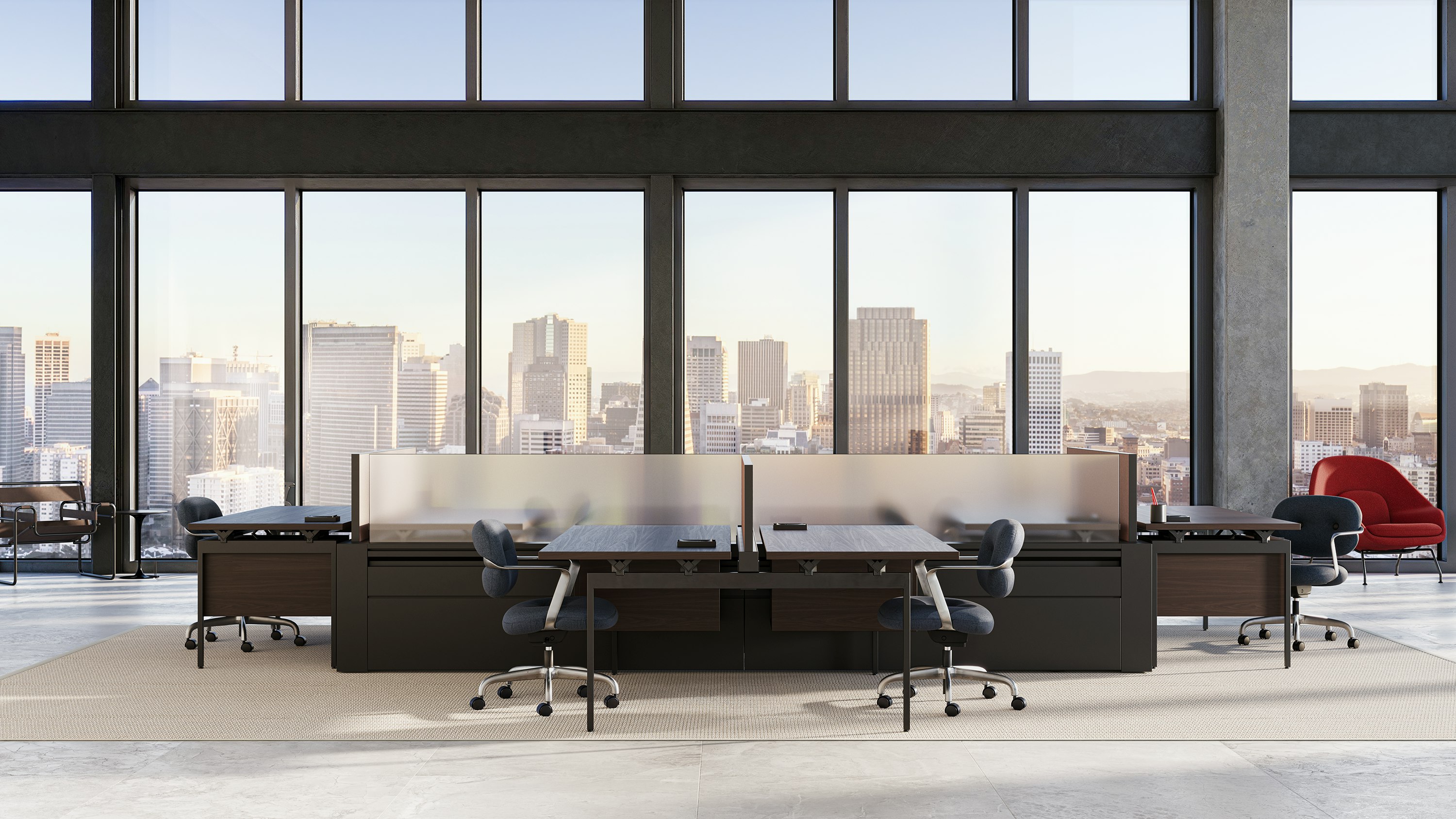 A hoteling workplace with four Morrison Hannah chairs at different Antenna desks.