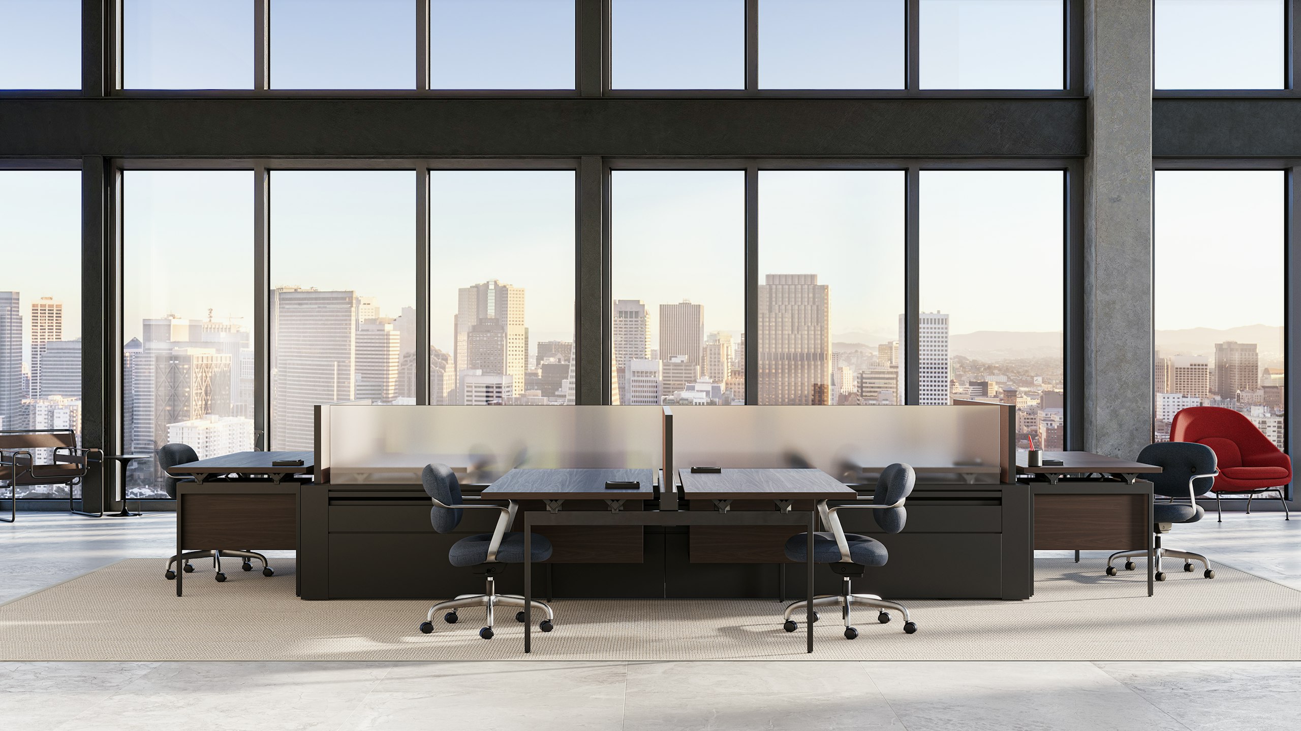A hoteling workplace with four Morrison Hannah chairs at different Antenna desks.