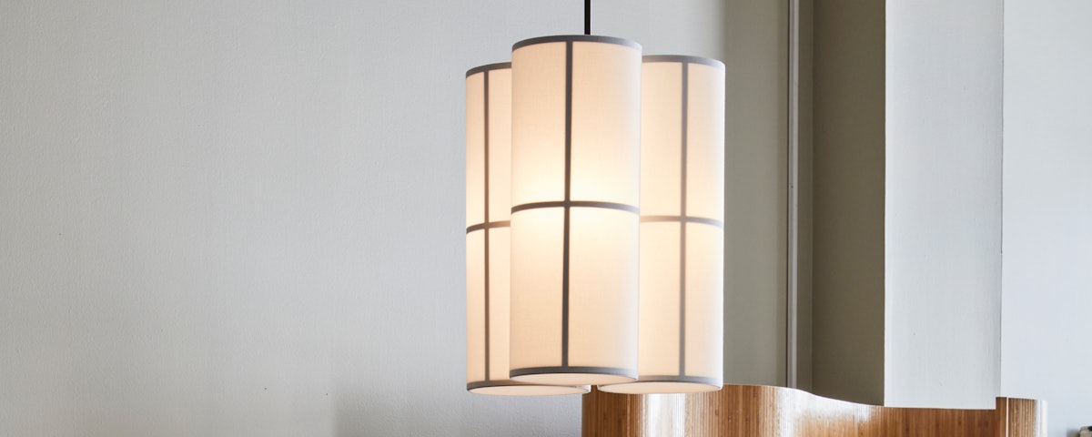 Hashira Pendant Lamp Cluster hanging in a dining room setting