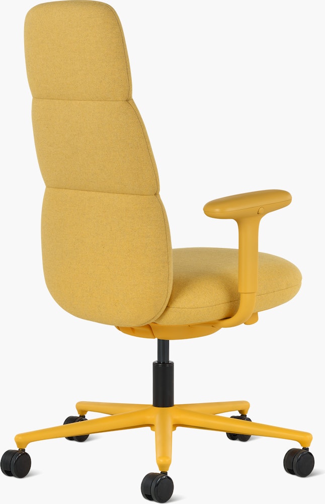 Rear angle view of a high-back Asari chair by Herman Miller in yellow with height adjustable arms.