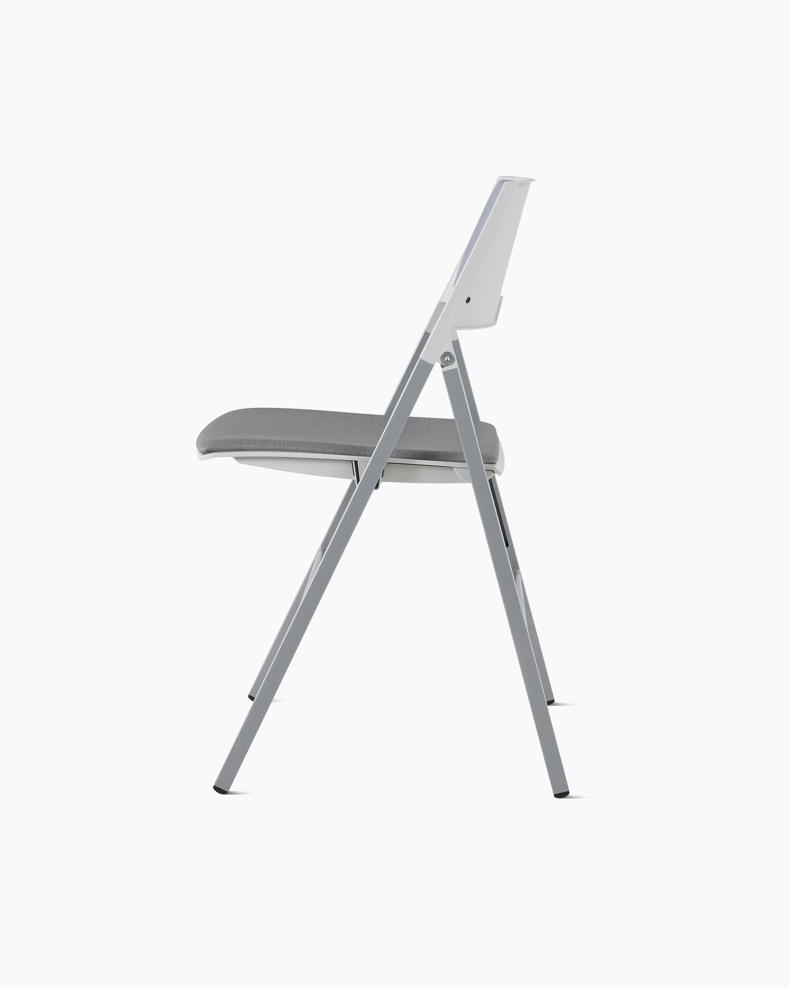 Side view of Axa Folding Chair with an upholstered back and seat in gray and silver metal frame and legs.