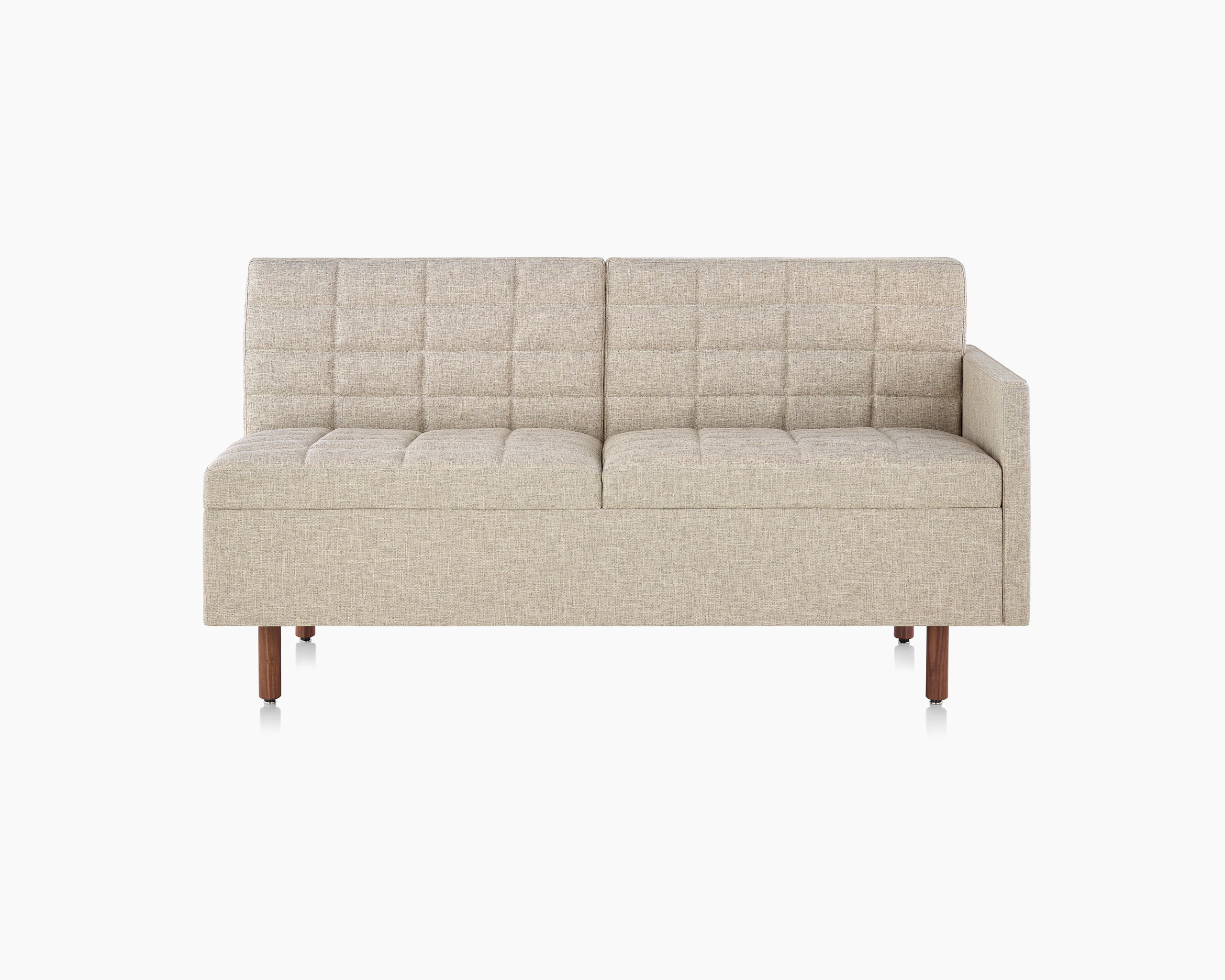 A quilted Tuxedo Classic connecting settee upholstered in bone-colored fabric, viewed from the front.