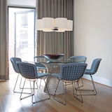 Platner Dining Table and Bertoia Side Chairs with blue seat covers