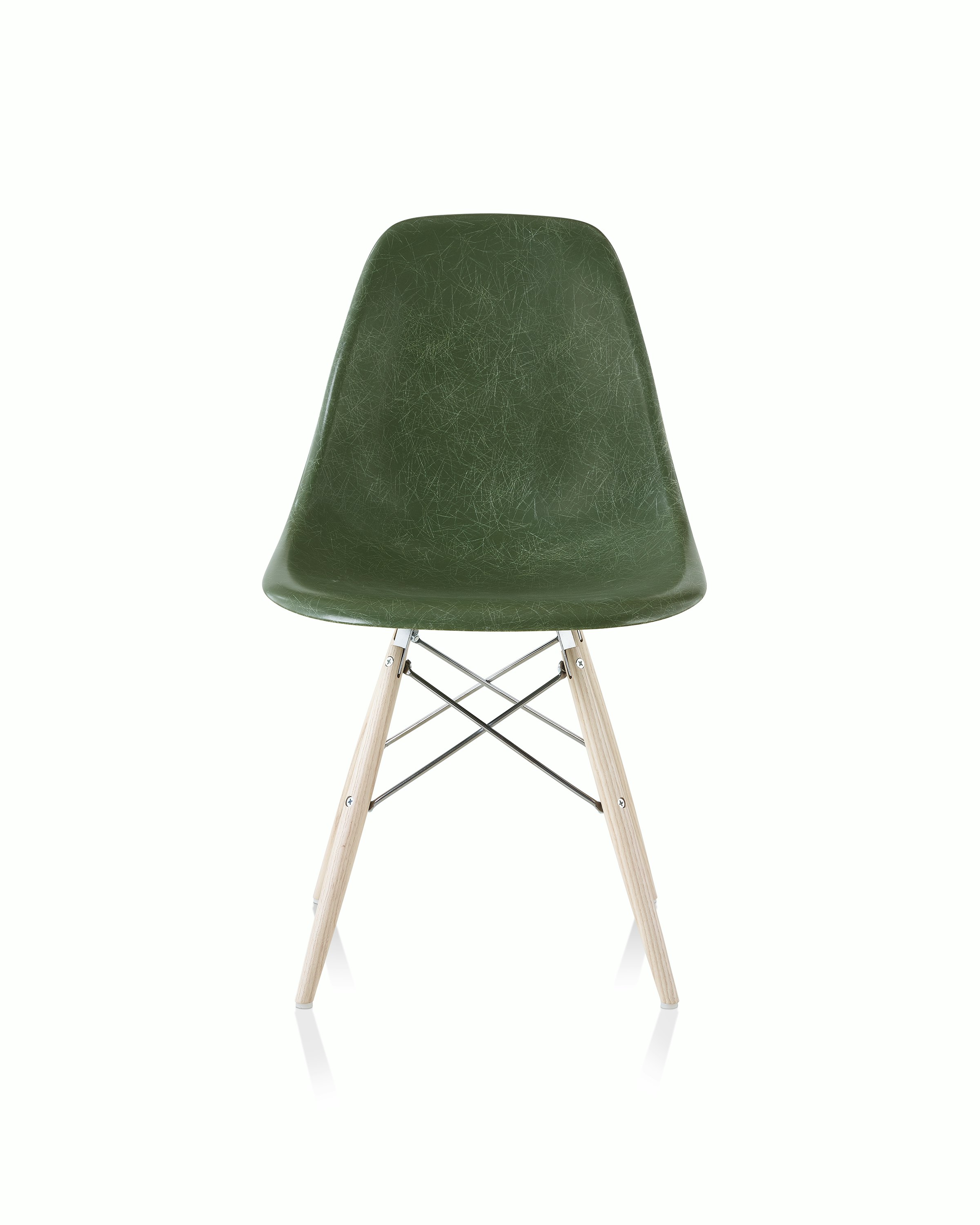 An Eames Molded Fiberglass Side Chair with a dowel base and dark green seat, viewed from the front.
