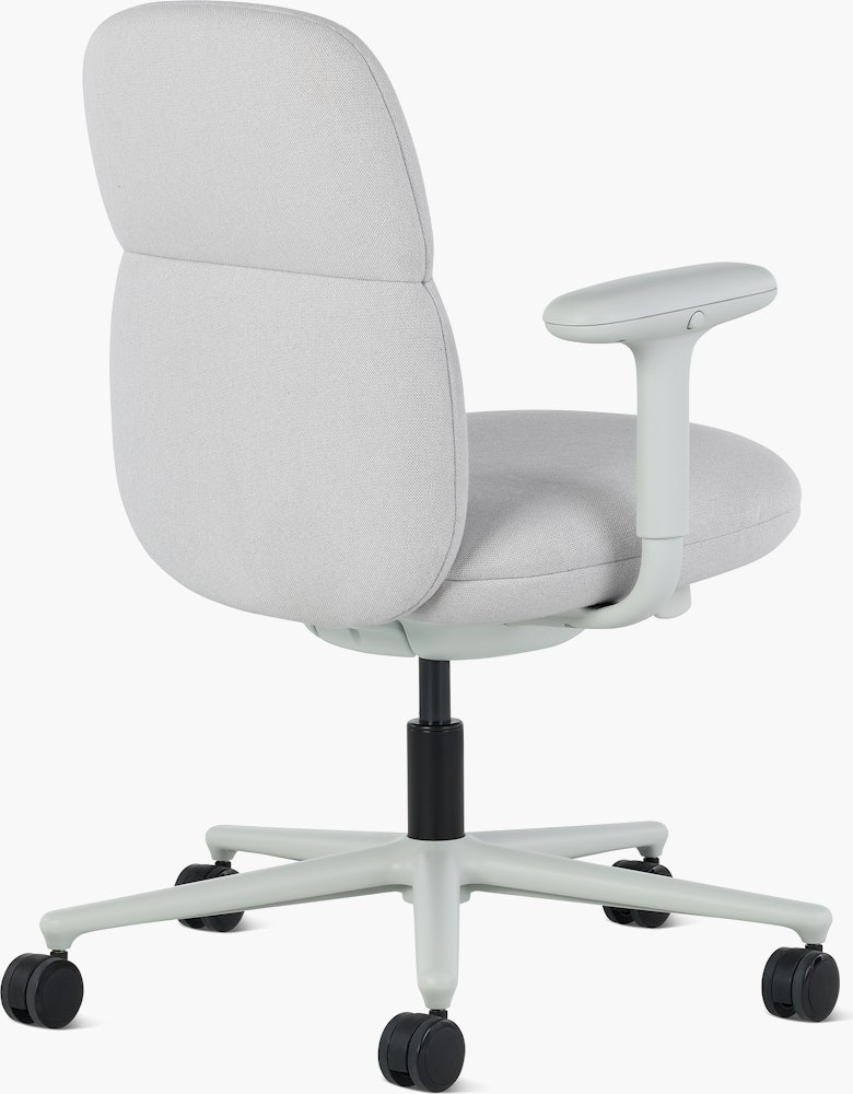 Rear angle view of a mid-back Asari chair by Herman Miller in light grey with height adjustable arms.