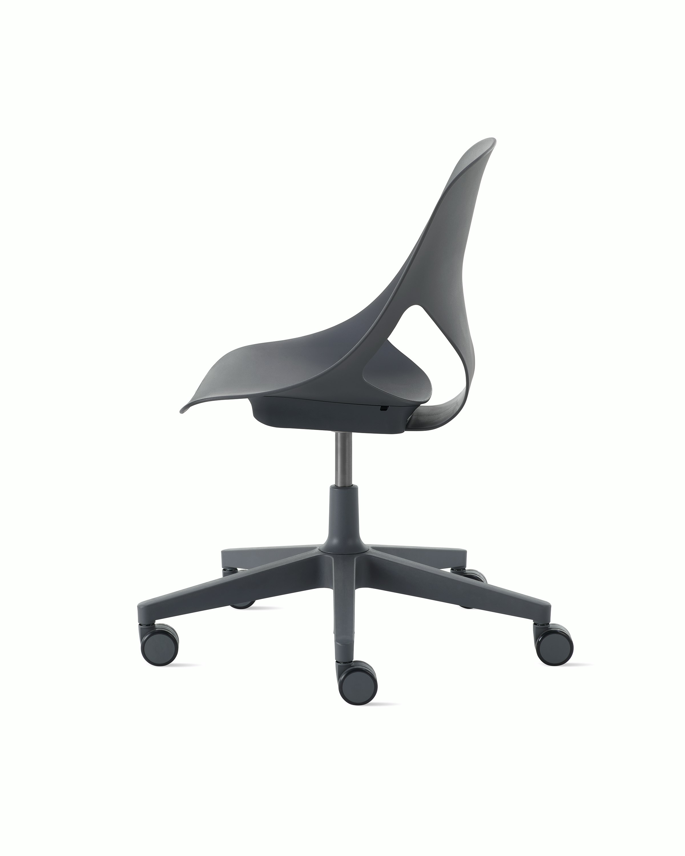 Side view of a dark grey armless Zeph chair.