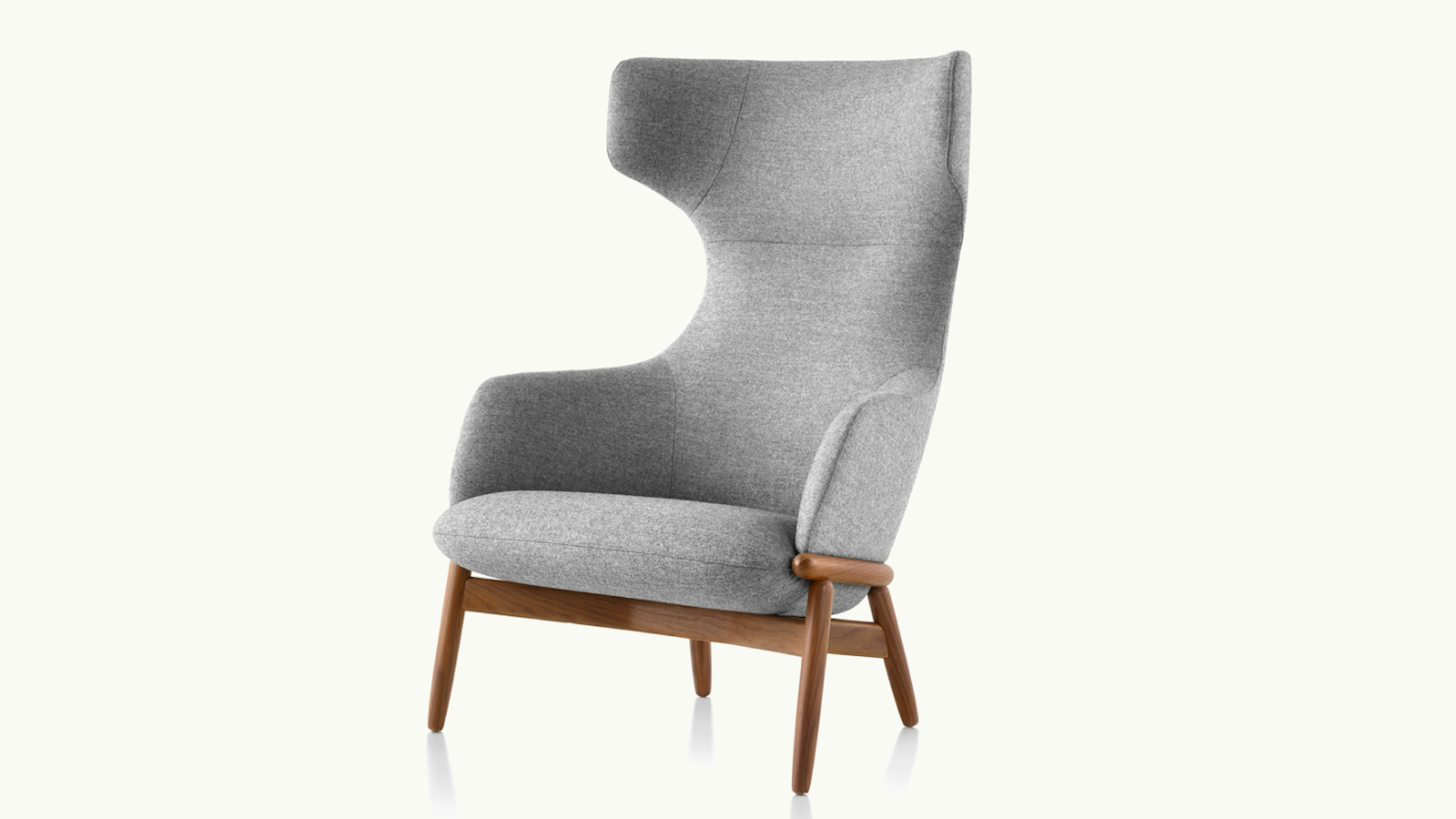 A three-quarter front-view image of a light grey Reframe Lounge Chair by Geiger