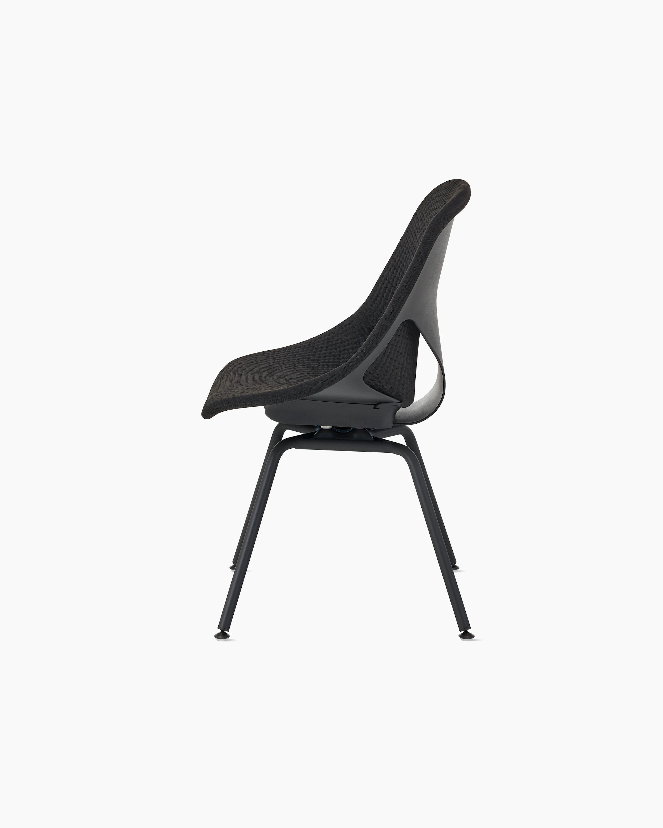 Side view of a black Zeph side chair without arms and a black unibody seat pad.