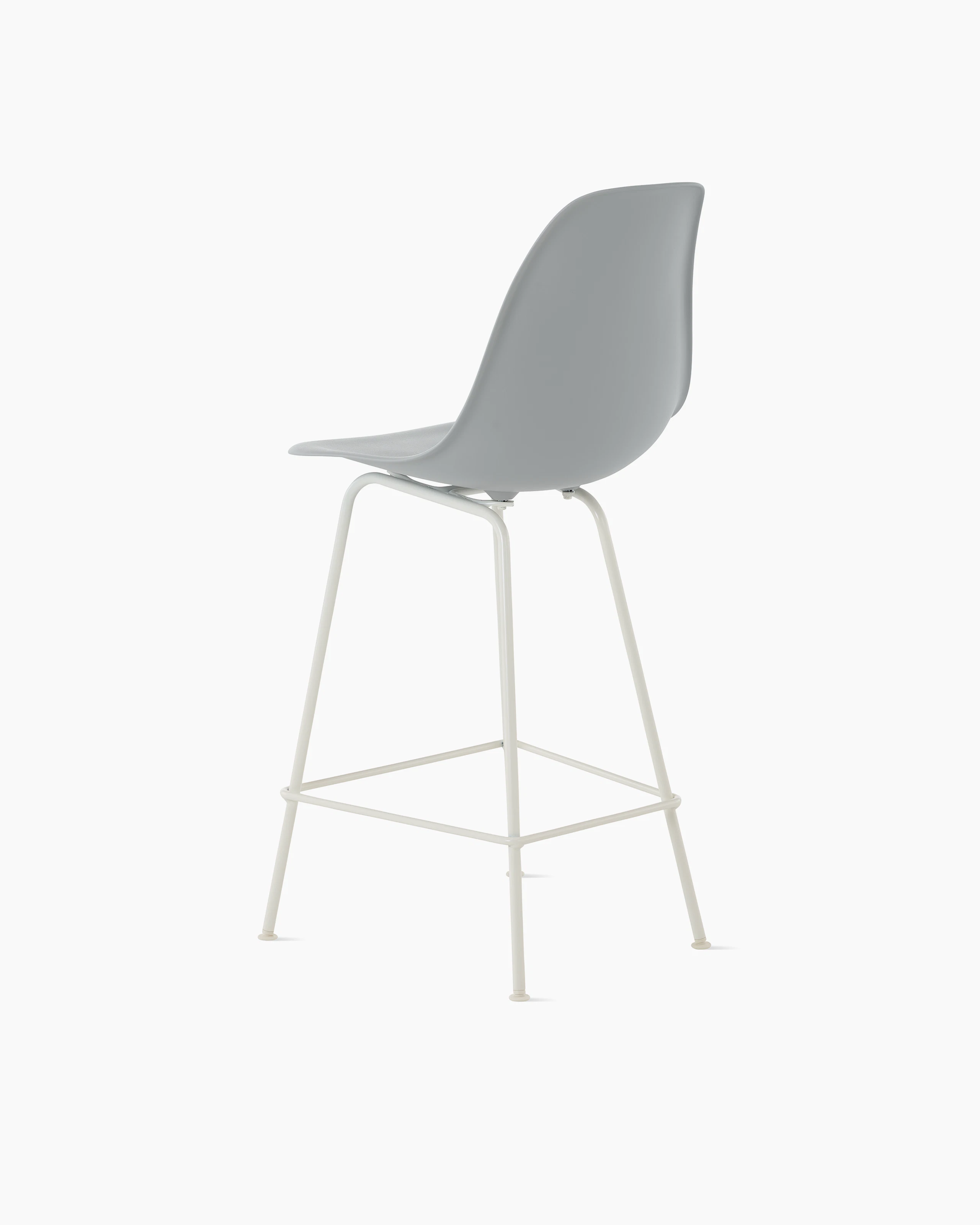 Back angle of light grey plastic shell stool on 4 leg base.
