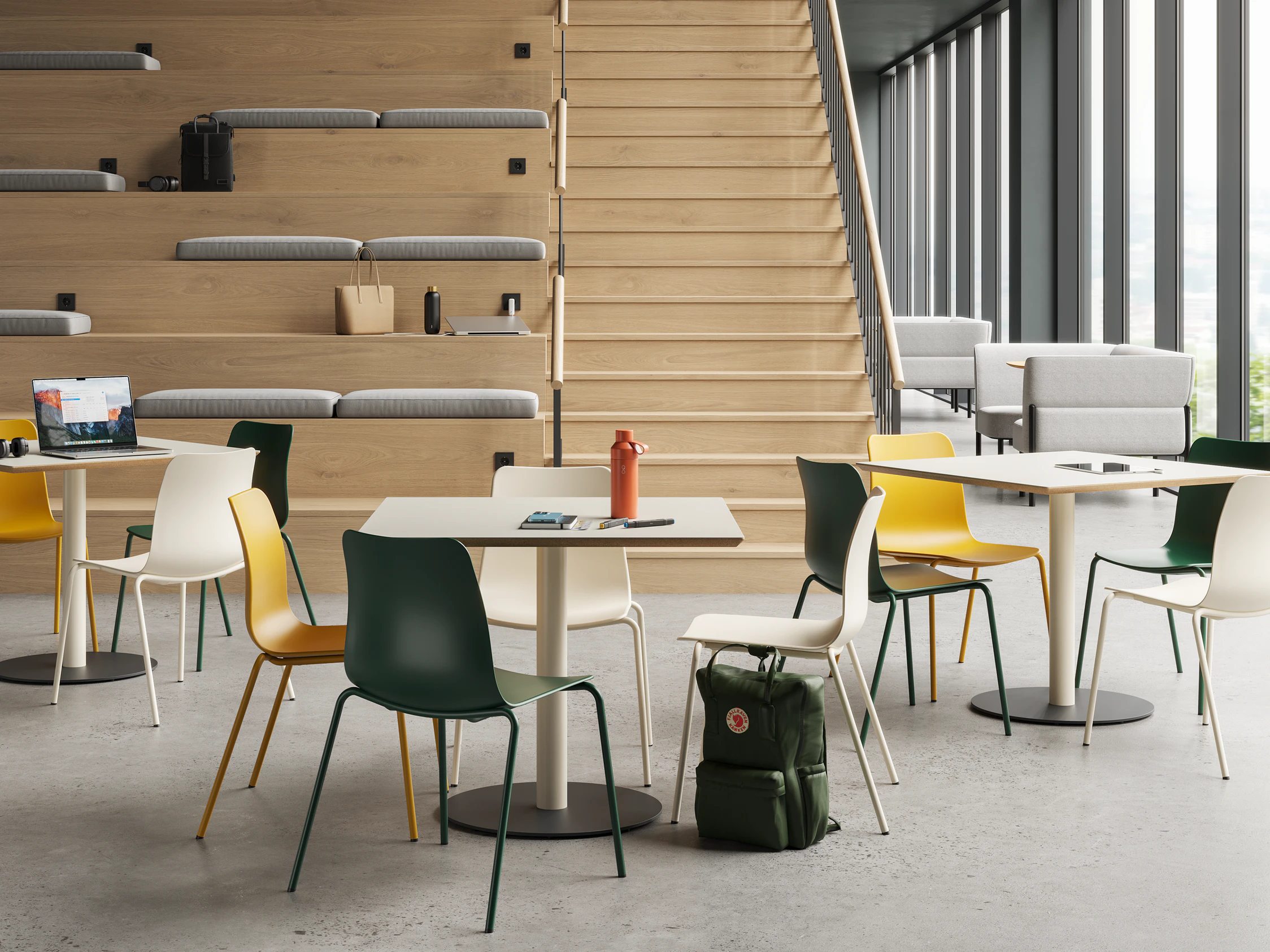 Tier Tables with Polly Chairs in mix of colours in a higher education setting.
