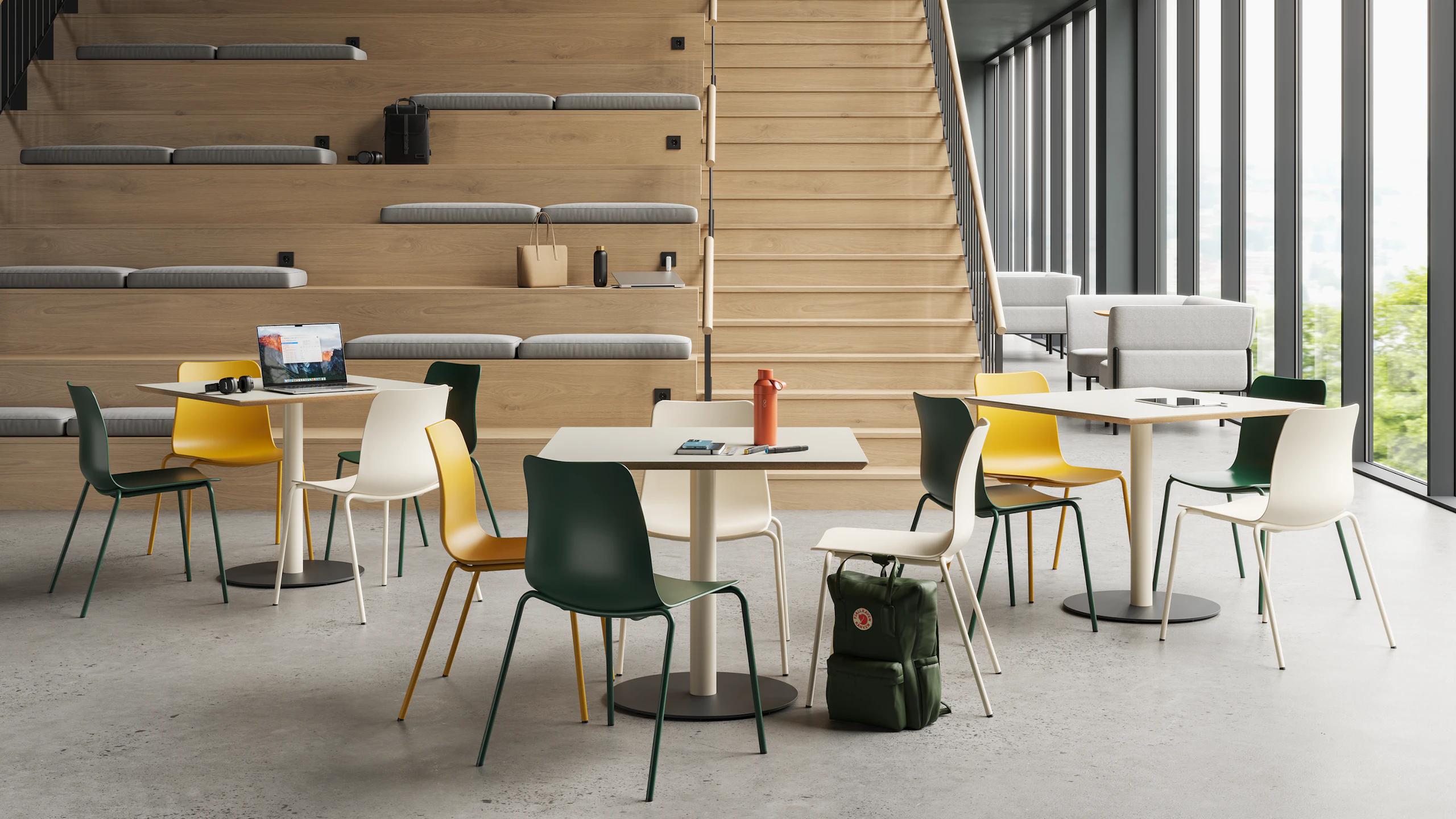Tier Tables with Polly Chairs in mix of colours in a higher education setting.