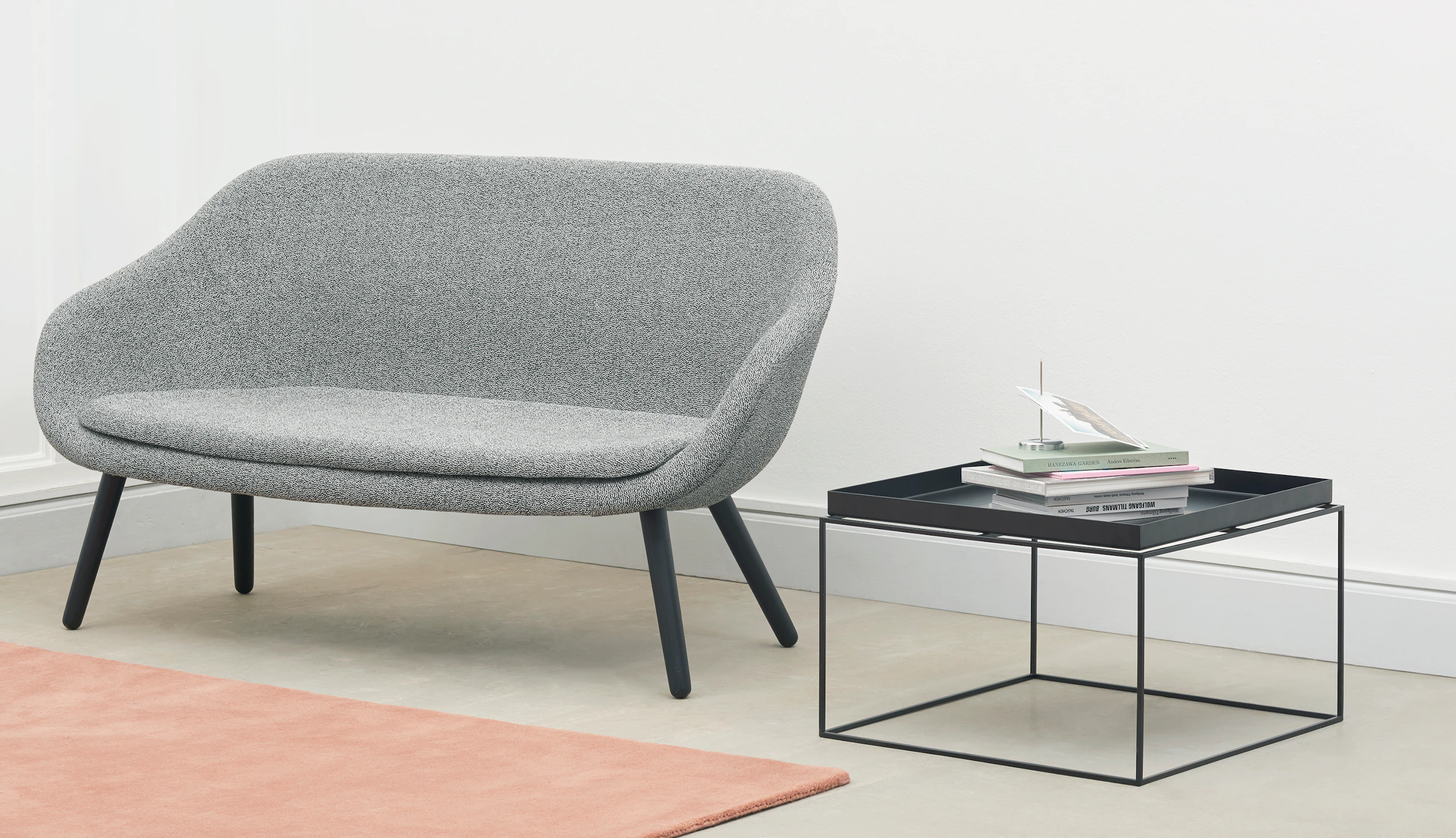 Black Tray Coffee Table alongside a grey About A Lounge Sofa.